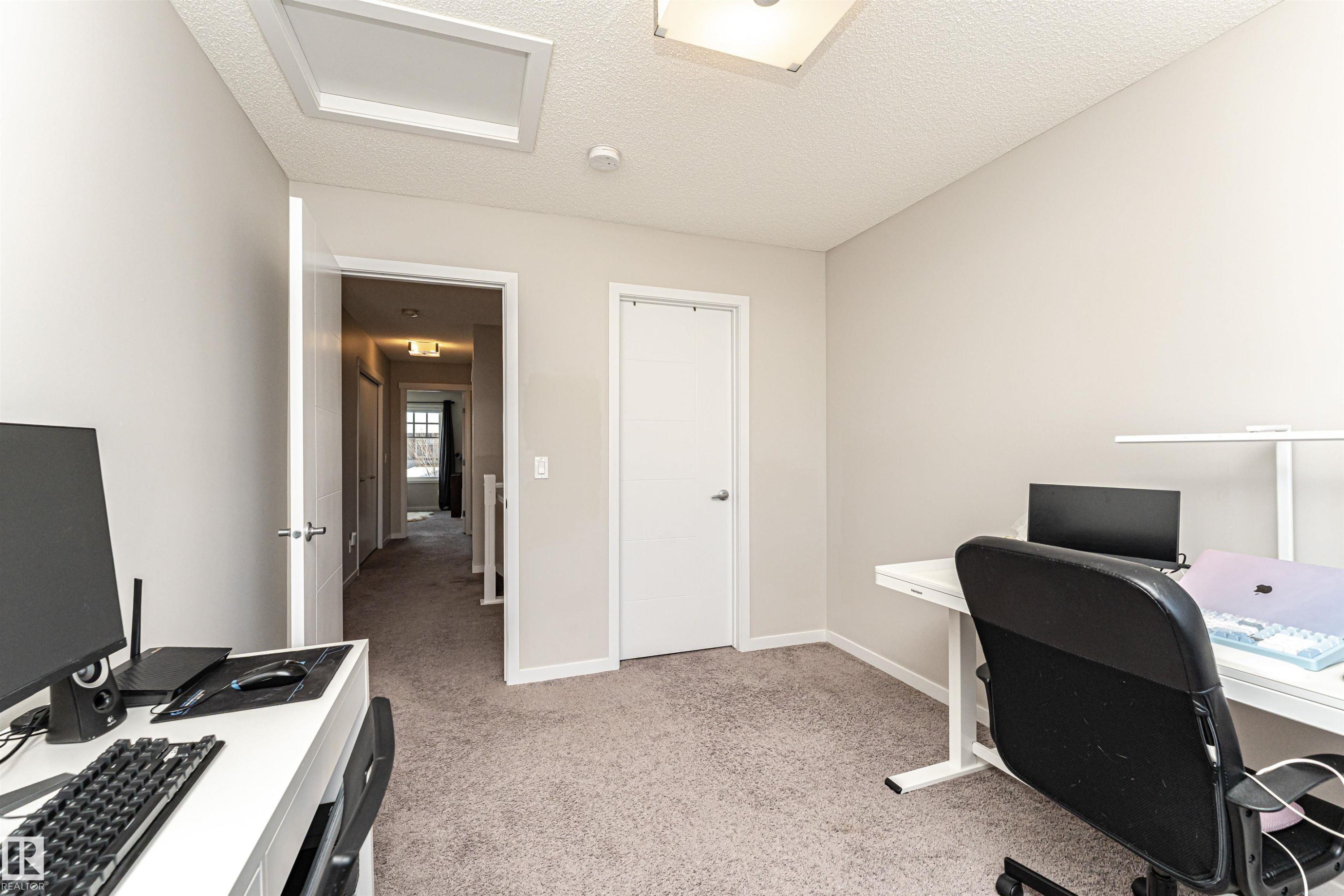 Office space featuring a textured ceiling and light colored carpet - 4008 Allan Crescent, Edmonton, AB - Indoor Photo Showing Office