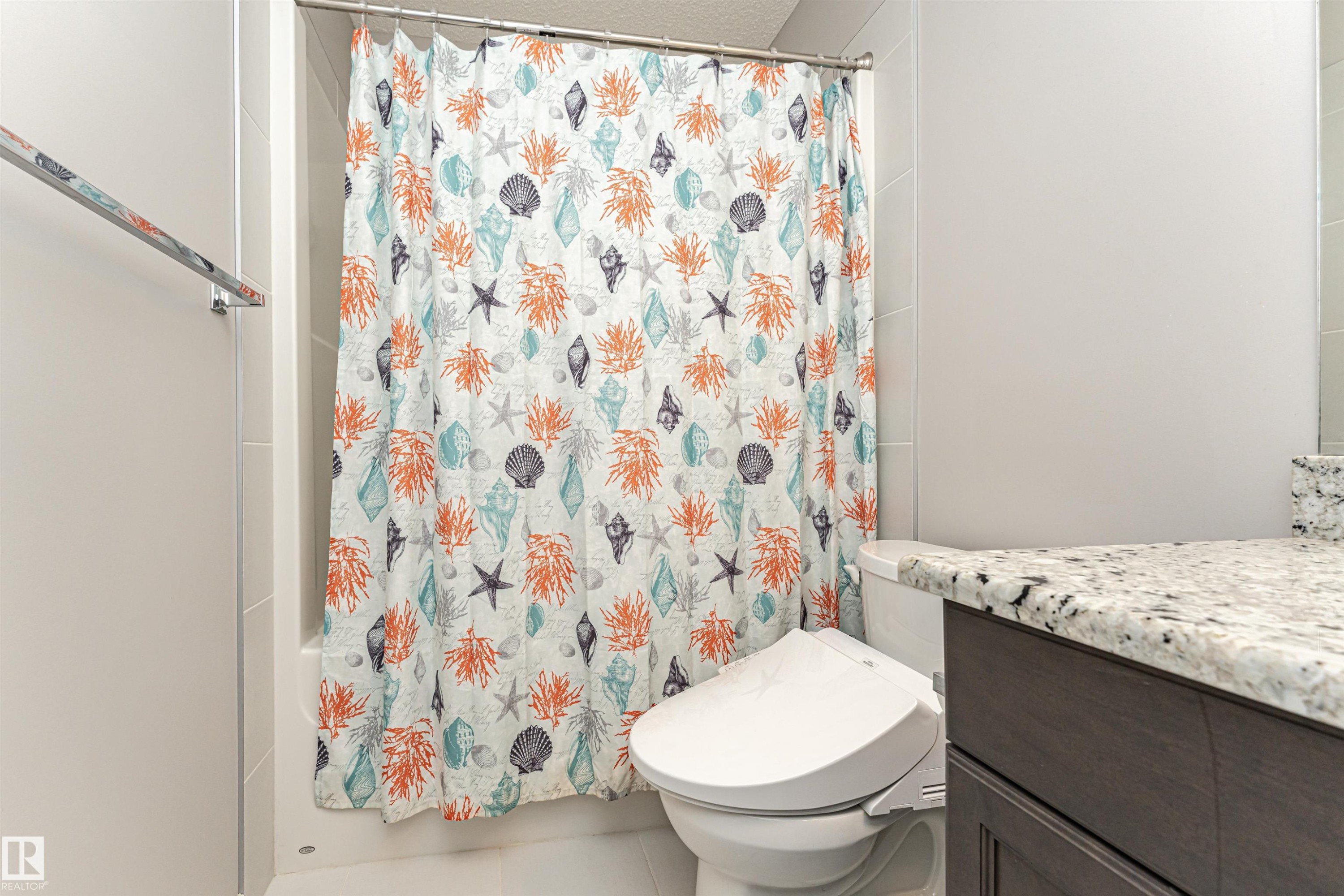 Full bath featuring vanity, shower / bathtub combination with curtain, and tile patterned floors - 4008 Allan Crescent, Edmonton, AB - Indoor Photo Showing Bathroom