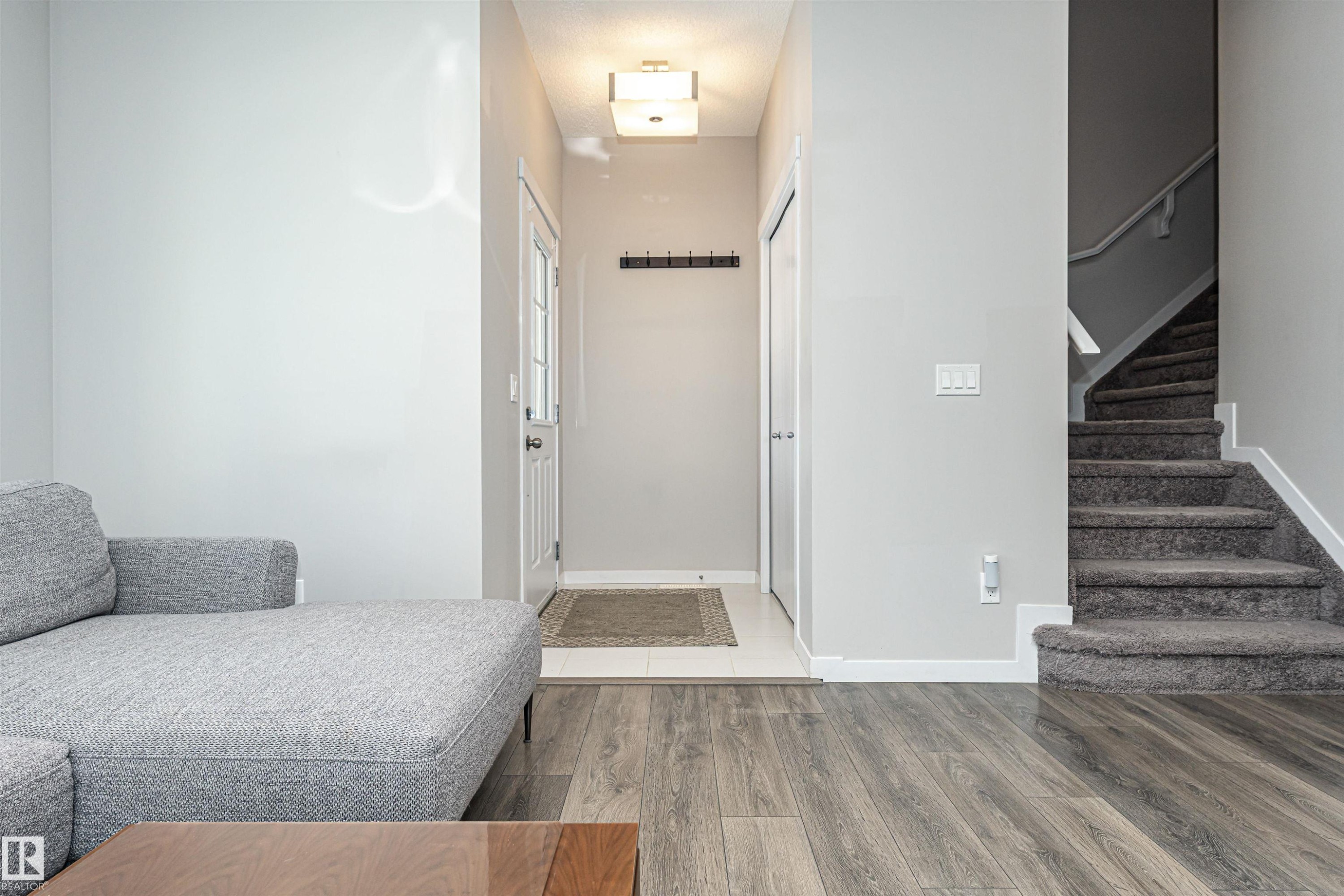 Foyer with wood finished floors and stairway - 4008 Allan Crescent, Edmonton, AB - Indoor Photo Showing Other Room
