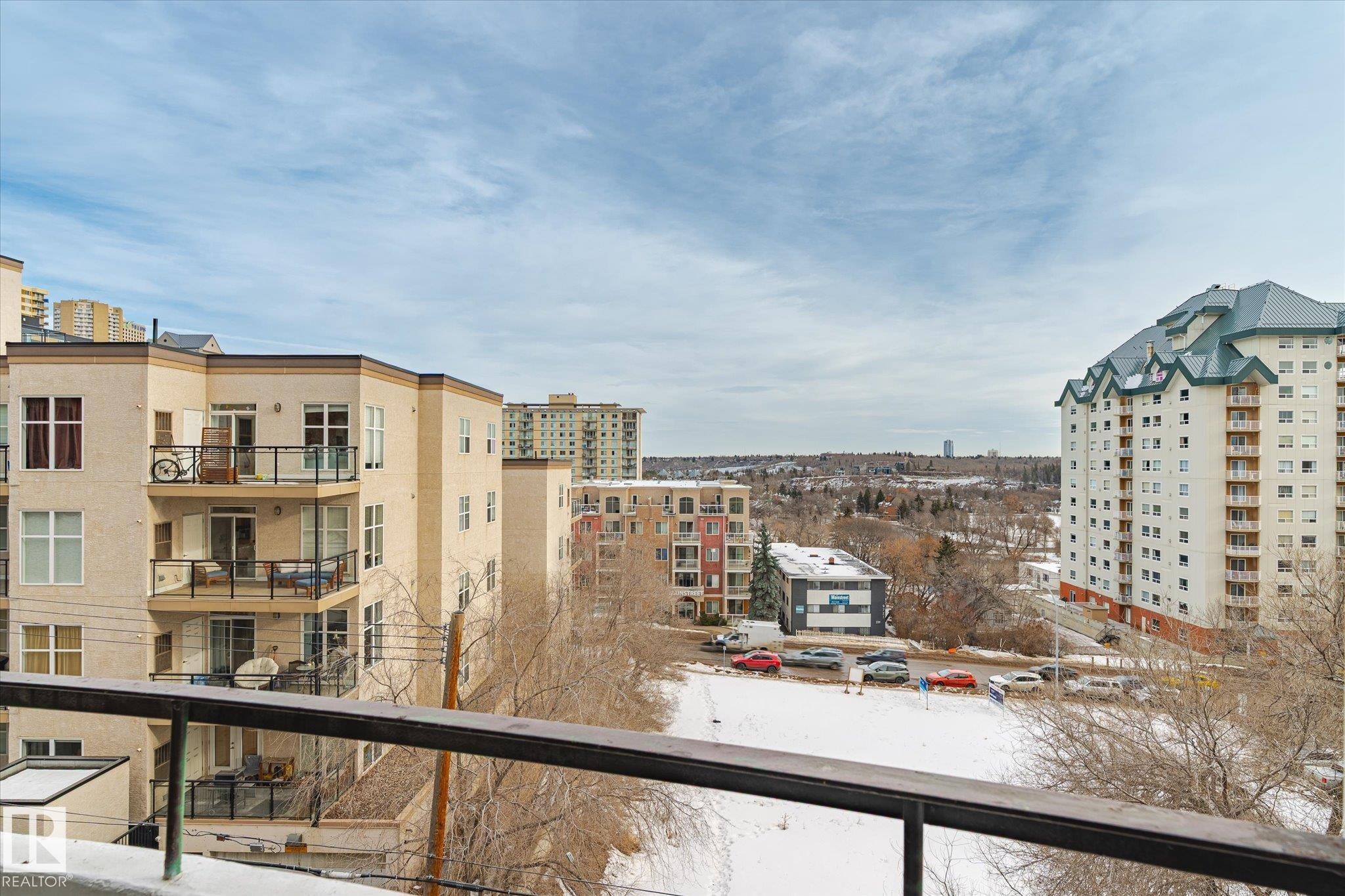 Snow covered back of property with grilling area - 304 9725 106 Street, Edmonton, AB - Outdoor