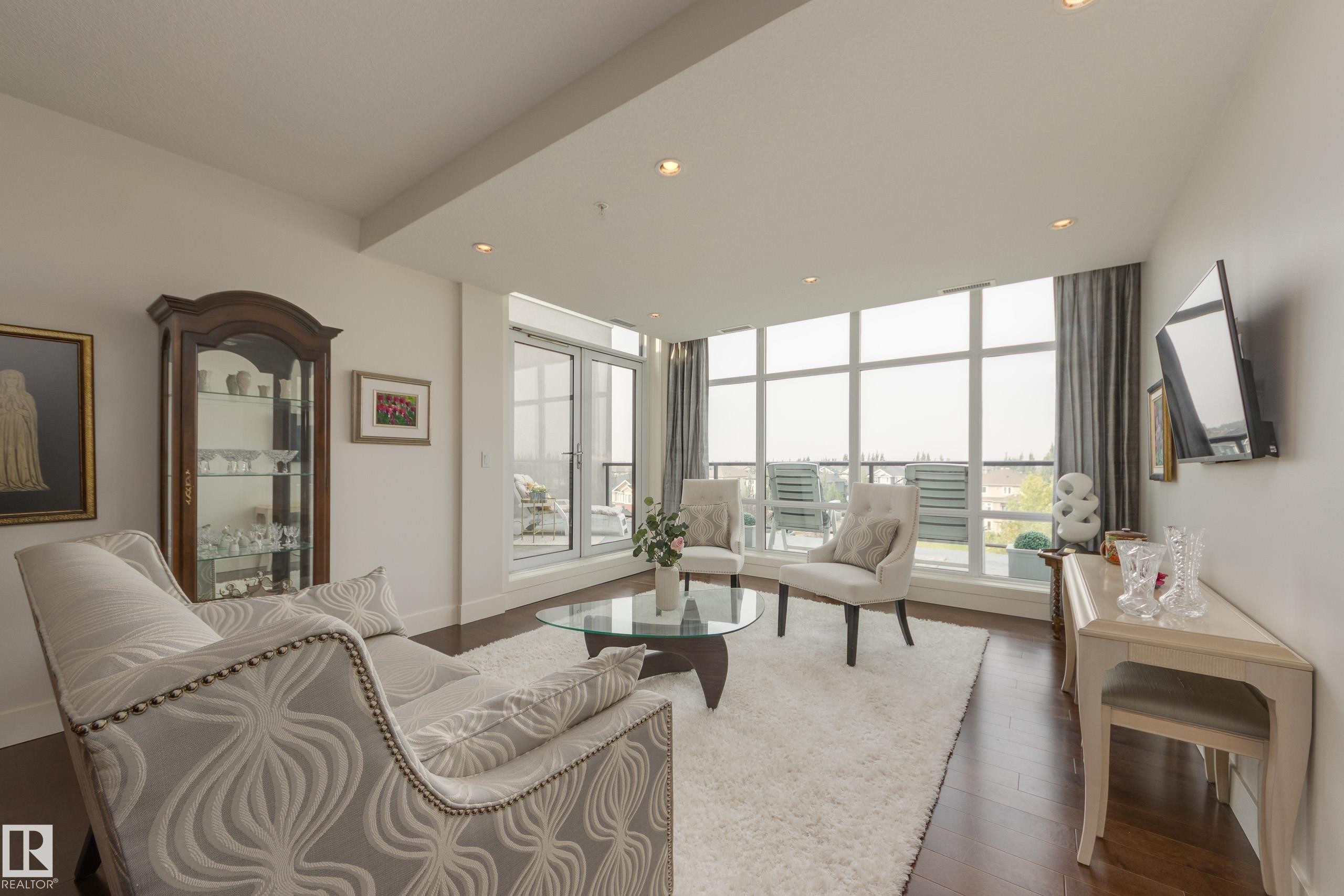 403 1350 Windermere Way, Edmonton, AB - Indoor Photo Showing Living Room