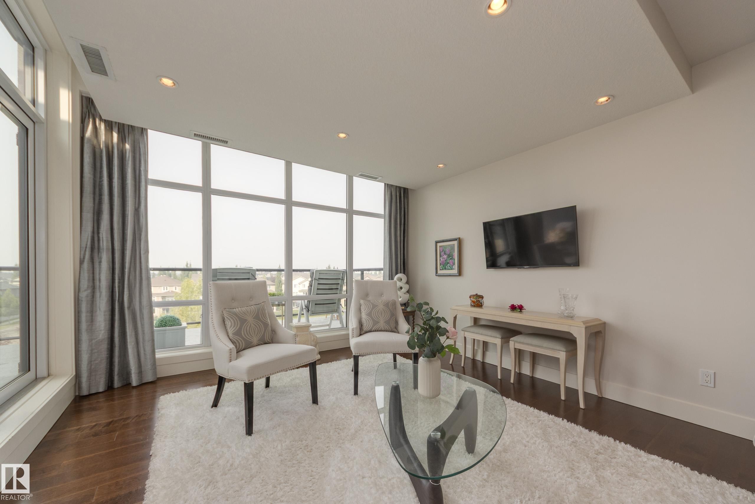 403 1350 Windermere Way, Edmonton, AB - Indoor Photo Showing Living Room