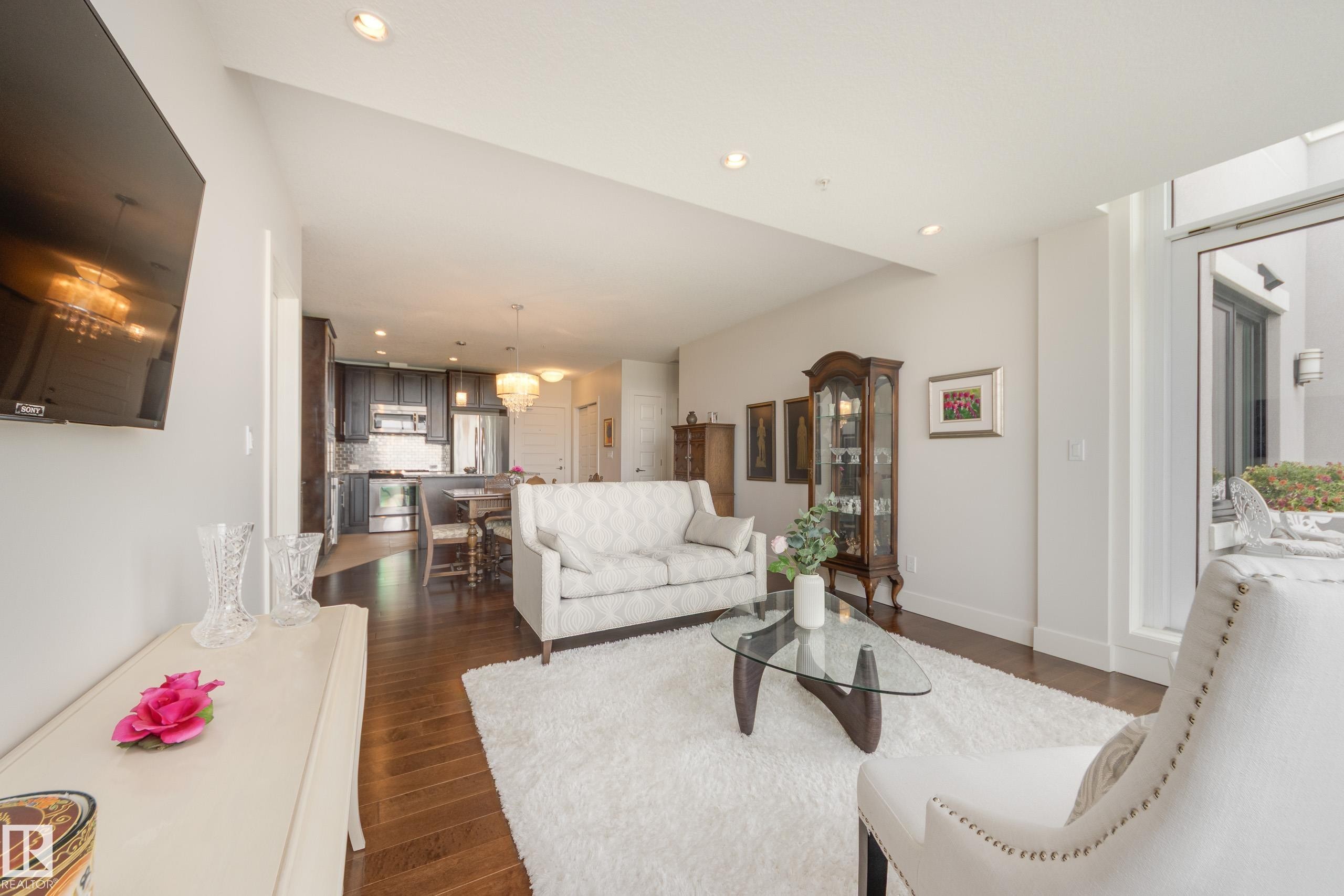 403 1350 Windermere Way, Edmonton, AB - Indoor Photo Showing Living Room
