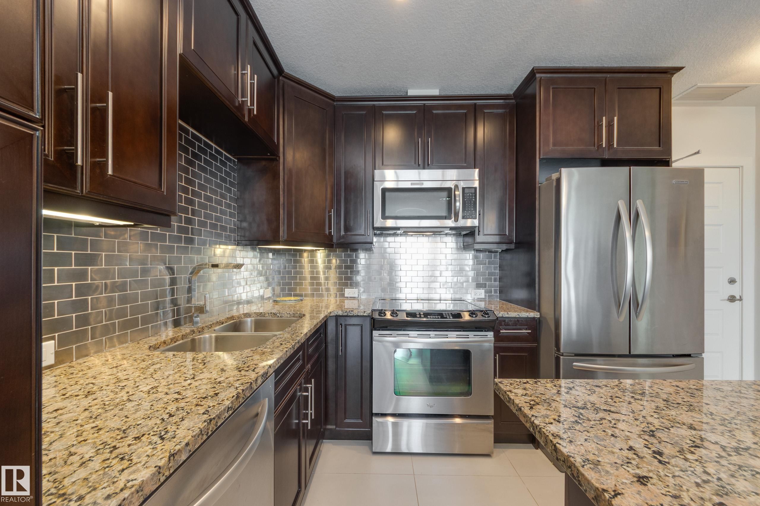 403 1350 Windermere Way, Edmonton, AB - Indoor Photo Showing Kitchen With Stainless Steel Kitchen With Double Sink With Upgraded Kitchen