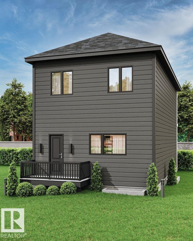 Back of property with a wooden deck and a lawn - 47 River Birch Way, St. Albert, AB - Outdoor With Deck Patio Veranda With Exterior