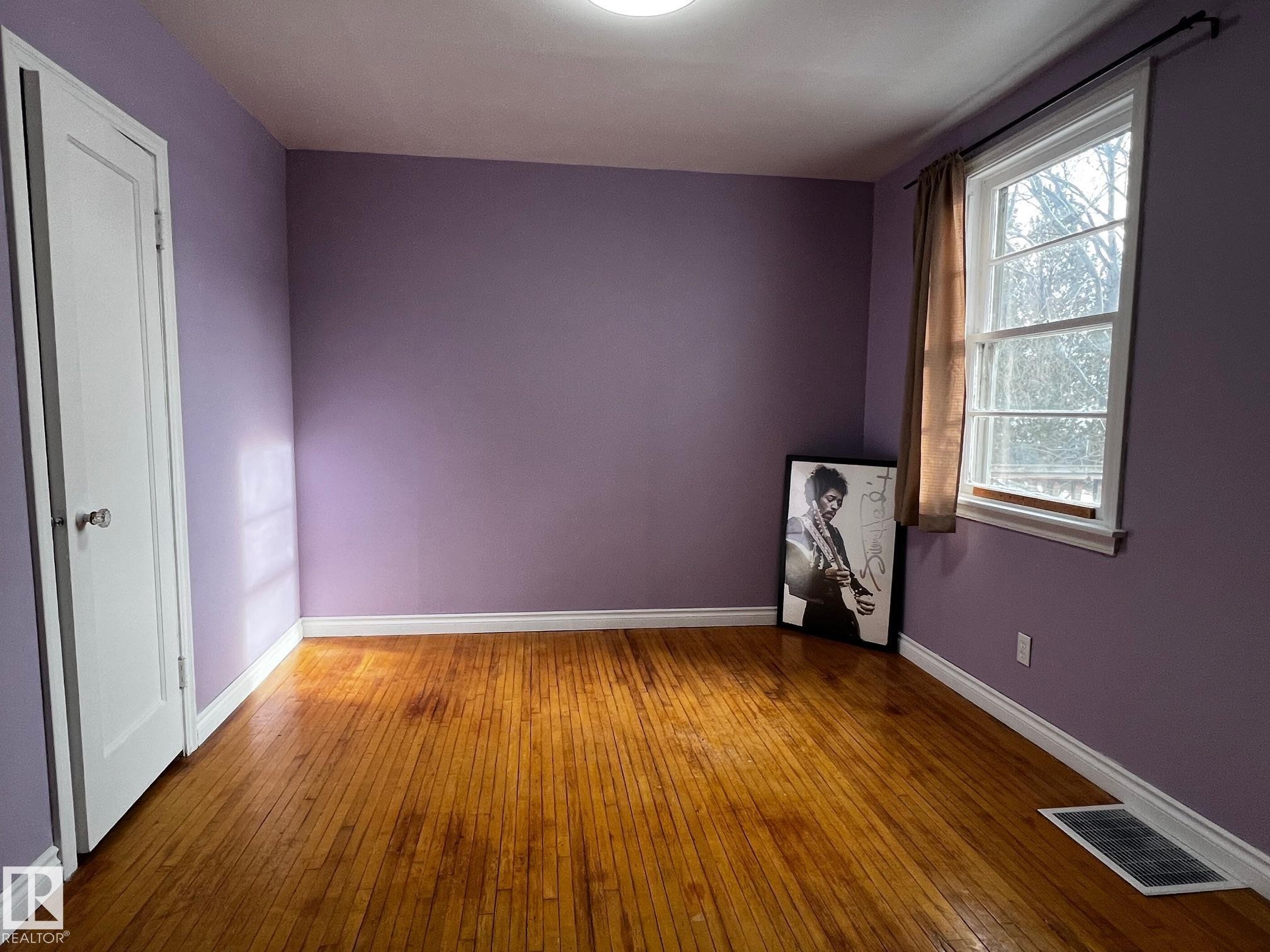 Spare room with hardwood / wood-style flooring - 10830 68 Avenue, Edmonton, AB - Indoor Photo Showing Other Room