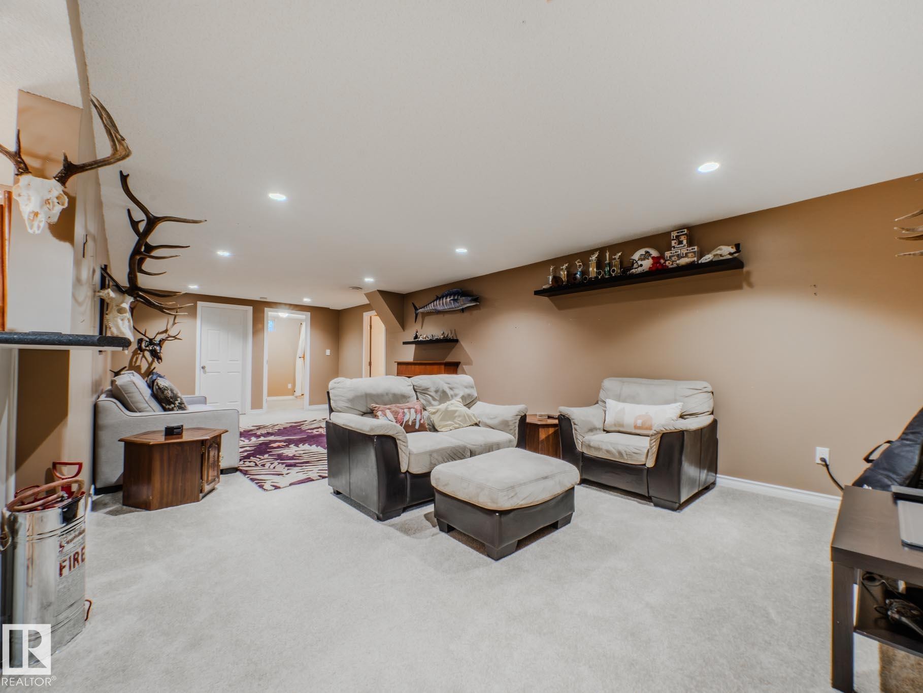 Carpeted living area featuring recessed lighting and baseboards - 3204 113B Street, Edmonton, AB - Indoor