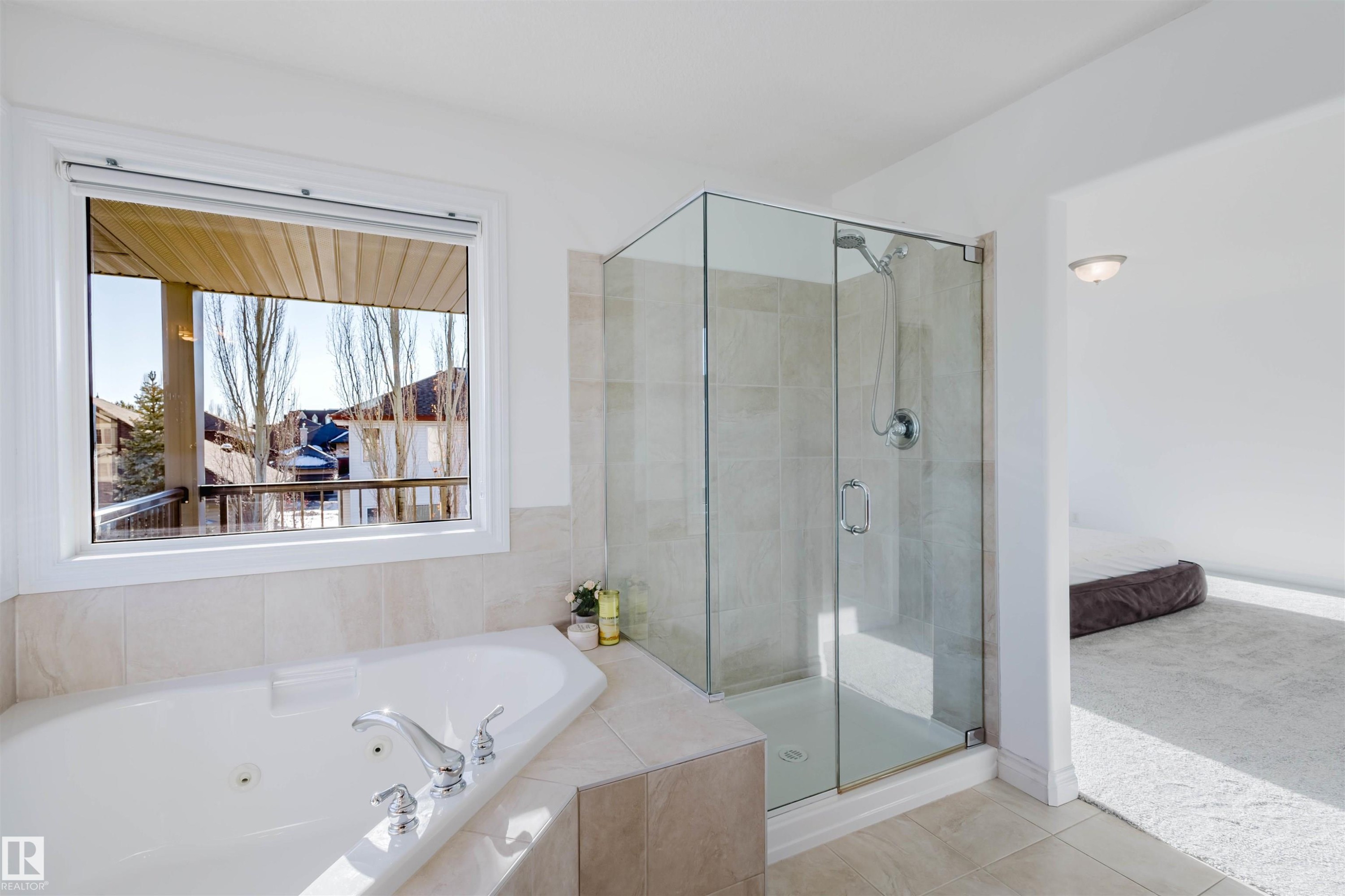 Bathroom with a tub with jets, a shower stall, tile patterned floors, and connected bathroom - 3547 Mclay Crescent, Edmonton, AB - Indoor Photo Showing Bathroom