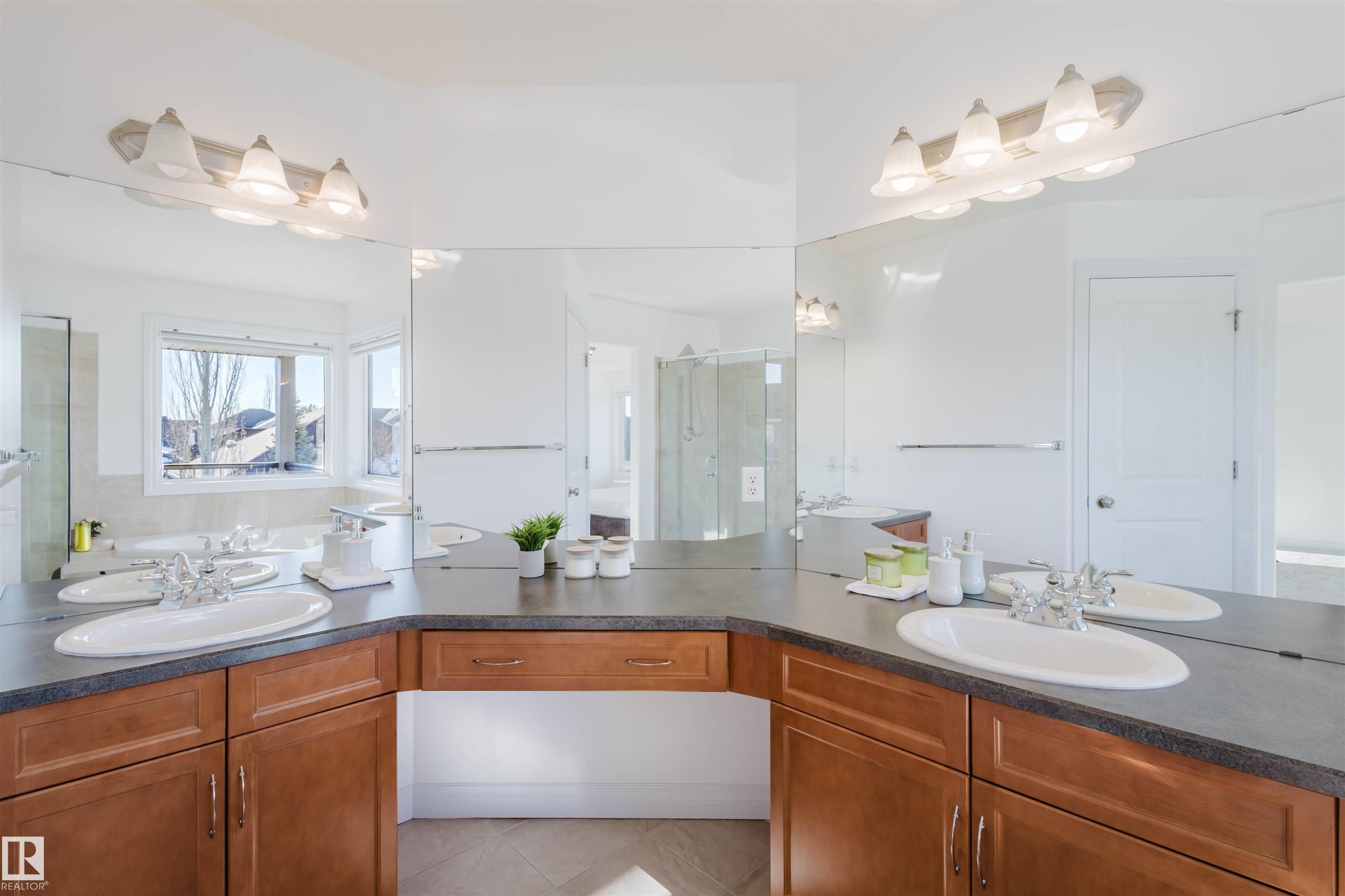 Bathroom with a stall shower, vanity, and tile patterned flooring - 3547 Mclay Crescent, Edmonton, AB - Indoor Photo Showing Bathroom