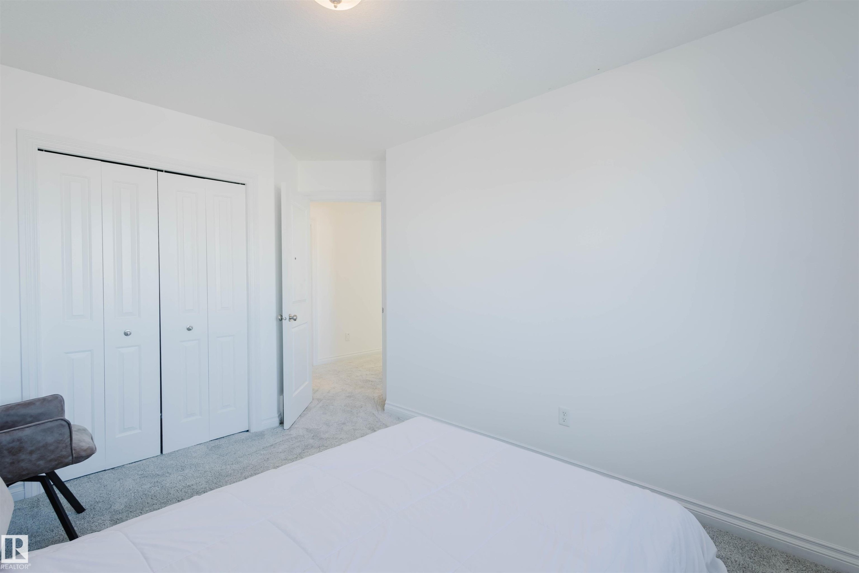 Carpeted bedroom with a closet and baseboards - 3547 Mclay Crescent, Edmonton, AB - Indoor Photo Showing Bedroom