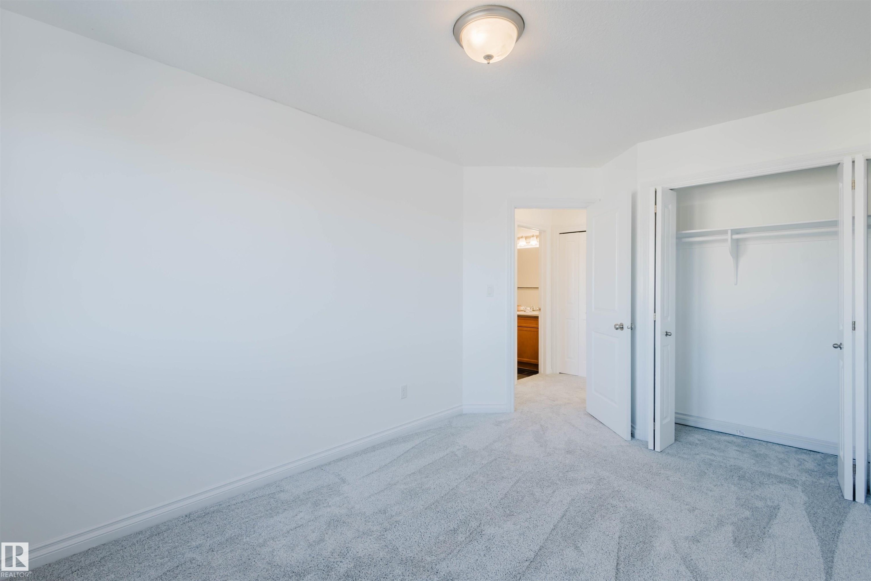 Unfurnished bedroom with carpet floors and a closet - 3547 Mclay Crescent, Edmonton, AB - Indoor Photo Showing Other Room