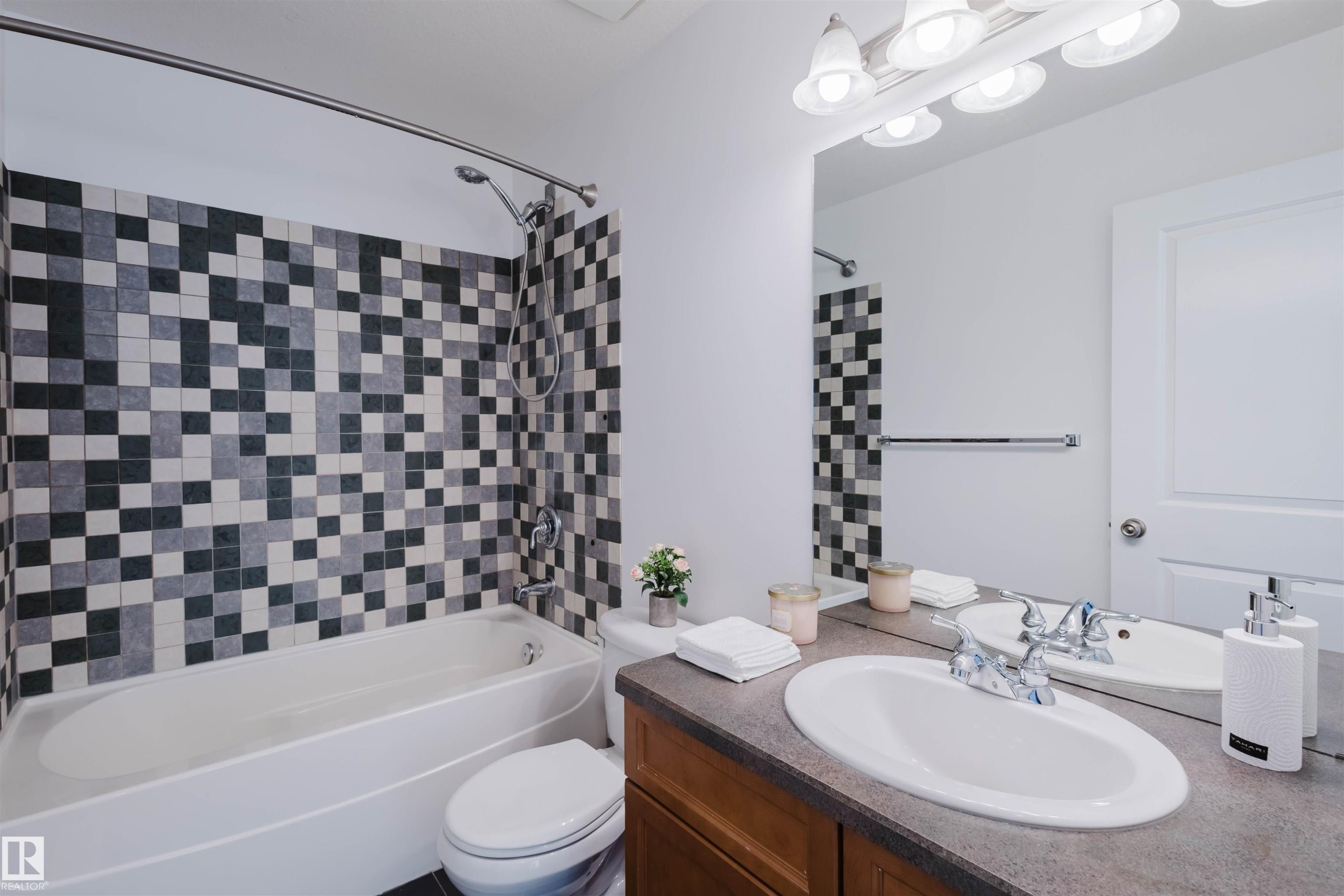 Full bathroom featuring shower / bath combination and vanity - 3547 Mclay Crescent, Edmonton, AB - Indoor Photo Showing Bathroom