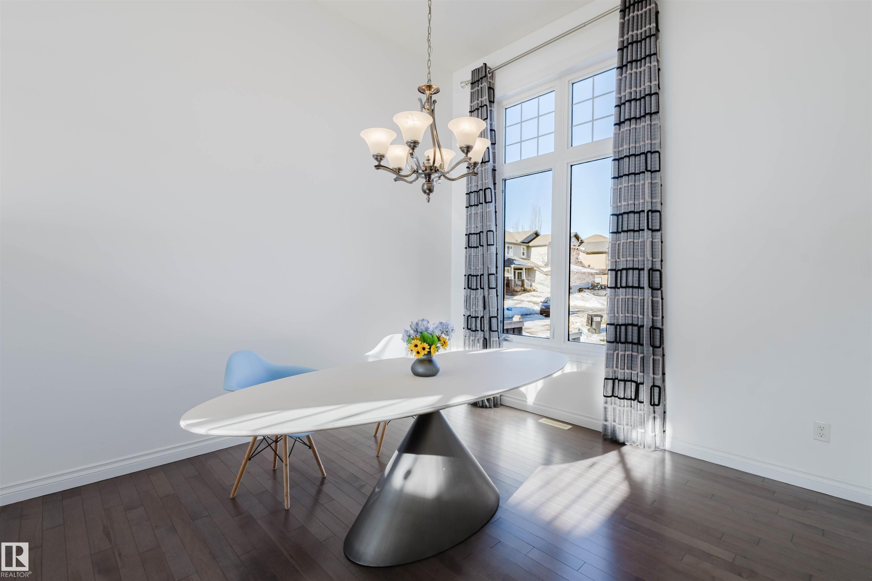 Dining room featuring dark wood-type flooring and hanging lights - 3547 Mclay Crescent, Edmonton, AB - Indoor Photo Showing Dining Room