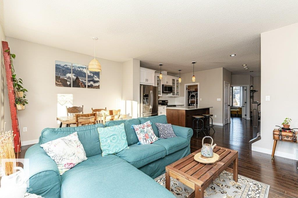 Living room featuring dark wood-style floors, recessed lighting, and a textured ceiling - 10535 67 Avenue, Edmonton, AB - Indoor Photo Showing Living Room