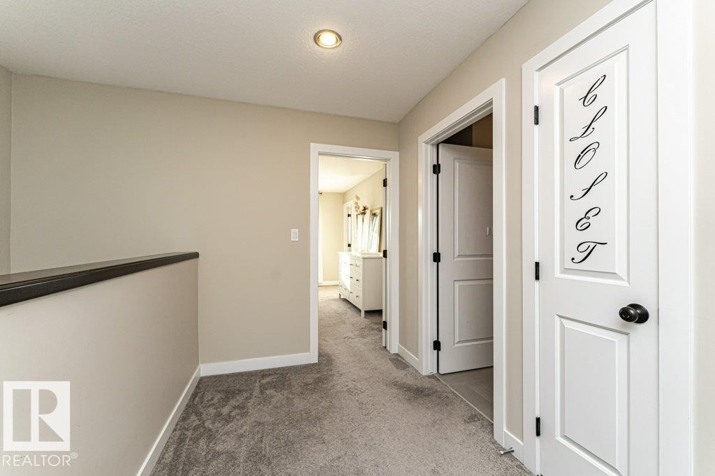 Hall with light colored carpet and baseboards - 10535 67 Avenue, Edmonton, AB - Indoor Photo Showing Other Room