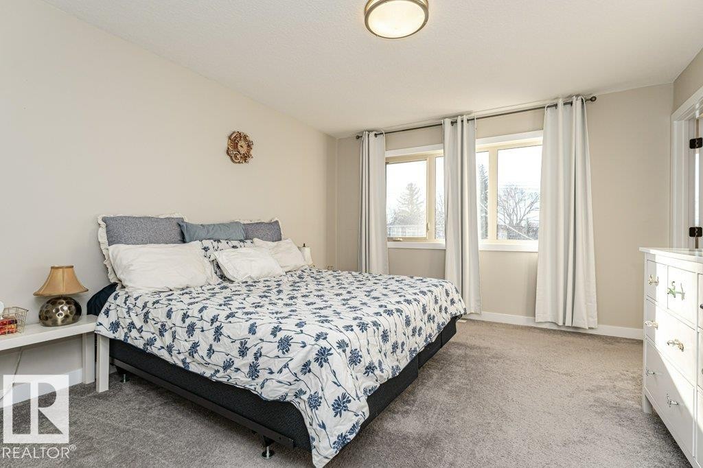 Bedroom featuring light colored carpet and baseboards - 10535 67 Avenue, Edmonton, AB - Indoor Photo Showing Bedroom