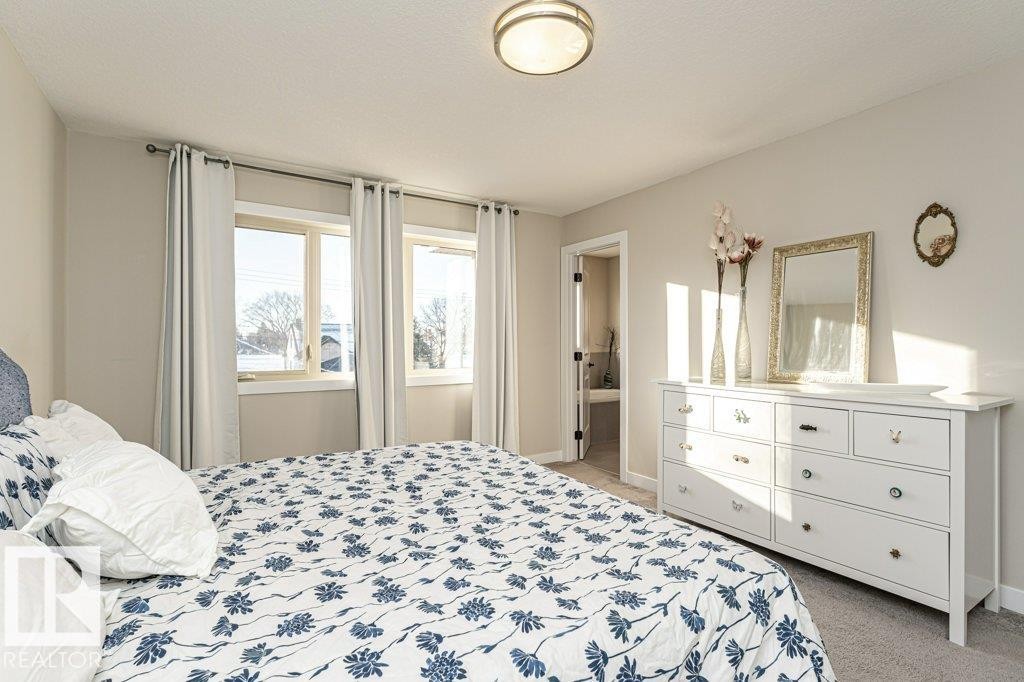 Bedroom featuring light carpet and baseboards - 10535 67 Avenue, Edmonton, AB - Indoor Photo Showing Bedroom