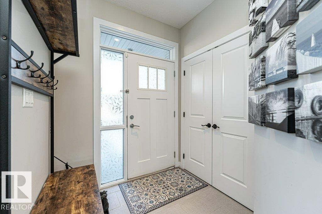 Entrance foyer featuring light tile patterned floors - 10535 67 Avenue, Edmonton, AB - Indoor Photo Showing Other Room