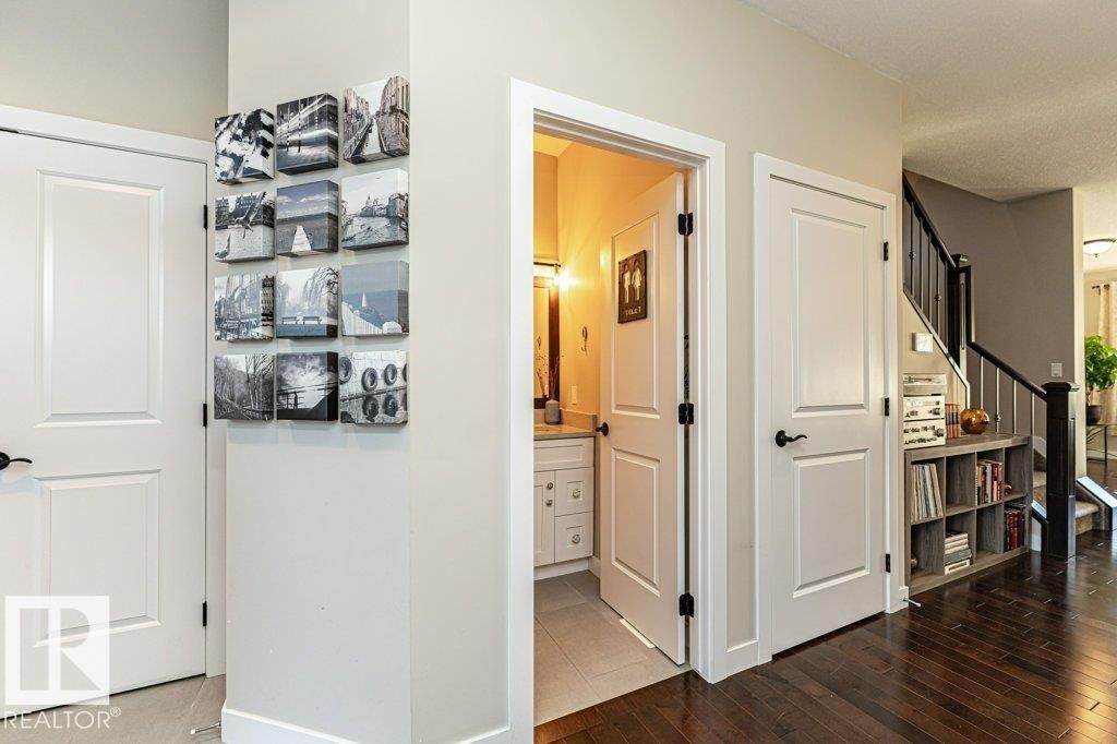 Hall featuring stairs and dark wood-style flooring - 10535 67 Avenue, Edmonton, AB - Indoor Photo Showing Other Room