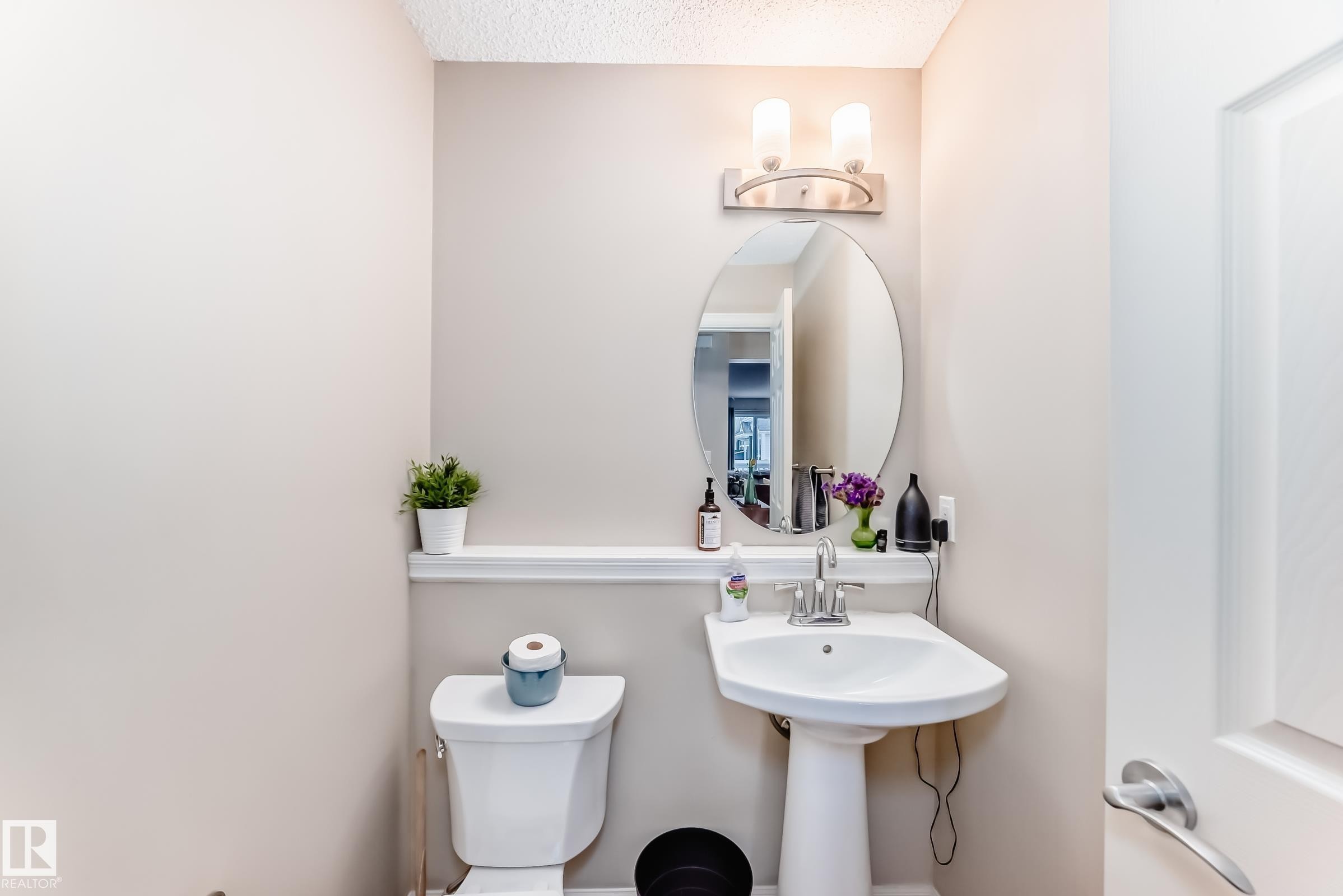 Half bath with toilet and a textured ceiling - 9645 Simpson Place, Edmonton, AB