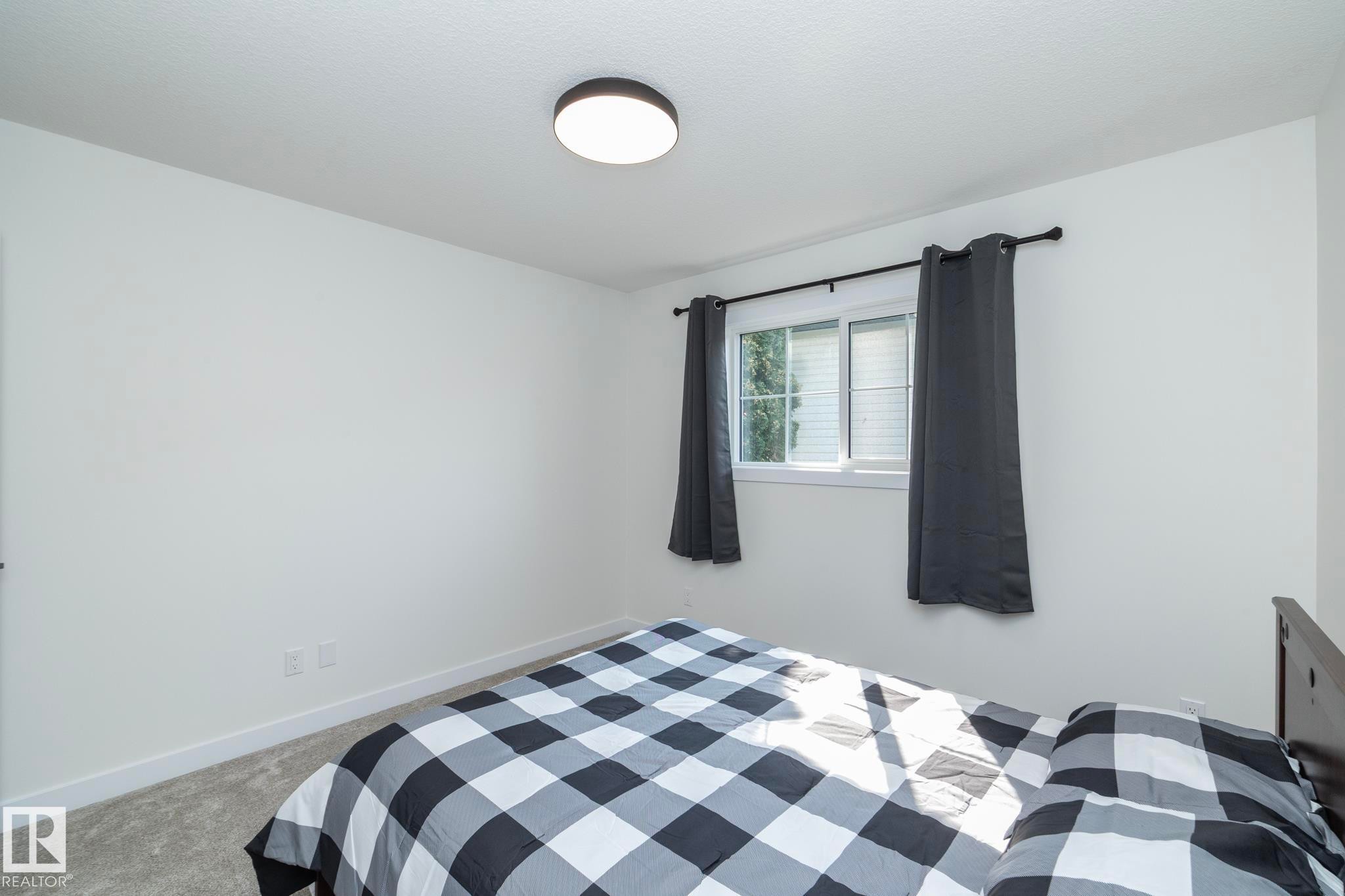 56 Brazeau Drive, Devon, AB - Indoor Photo Showing Bedroom
