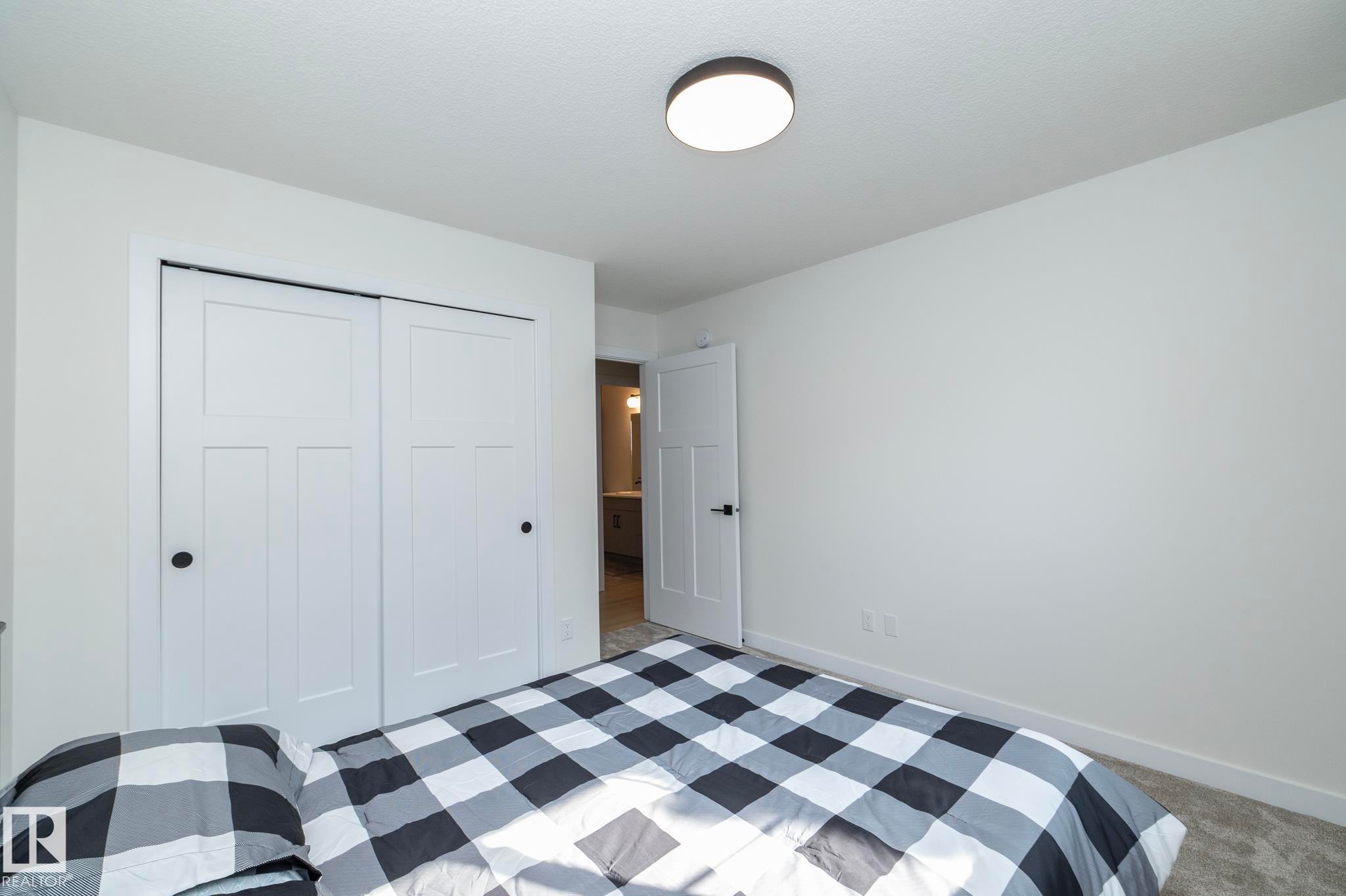 56 Brazeau Drive, Devon, AB - Indoor Photo Showing Bedroom