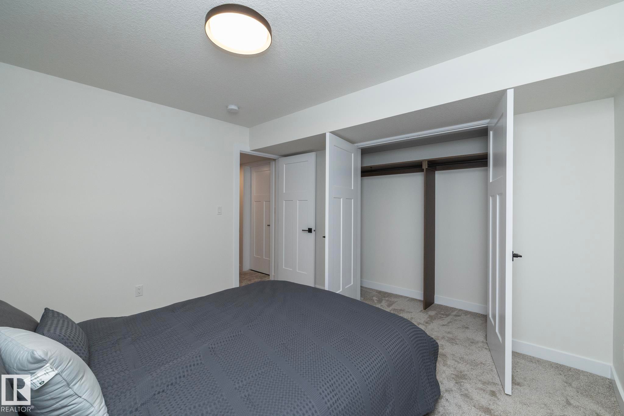 56 Brazeau Drive, Devon, AB - Indoor Photo Showing Bedroom