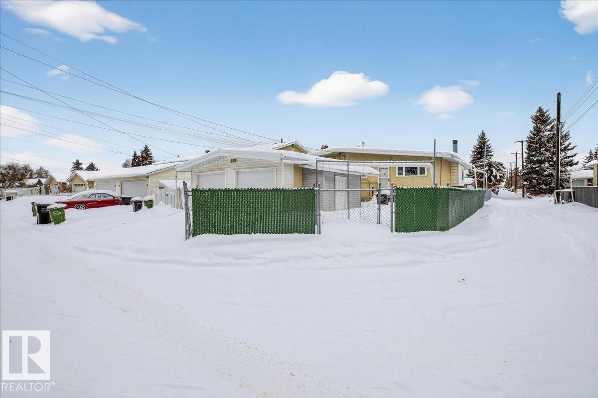View of front facade featuring a fenced front yard and a gate - Edmonton, AB - Outdoor