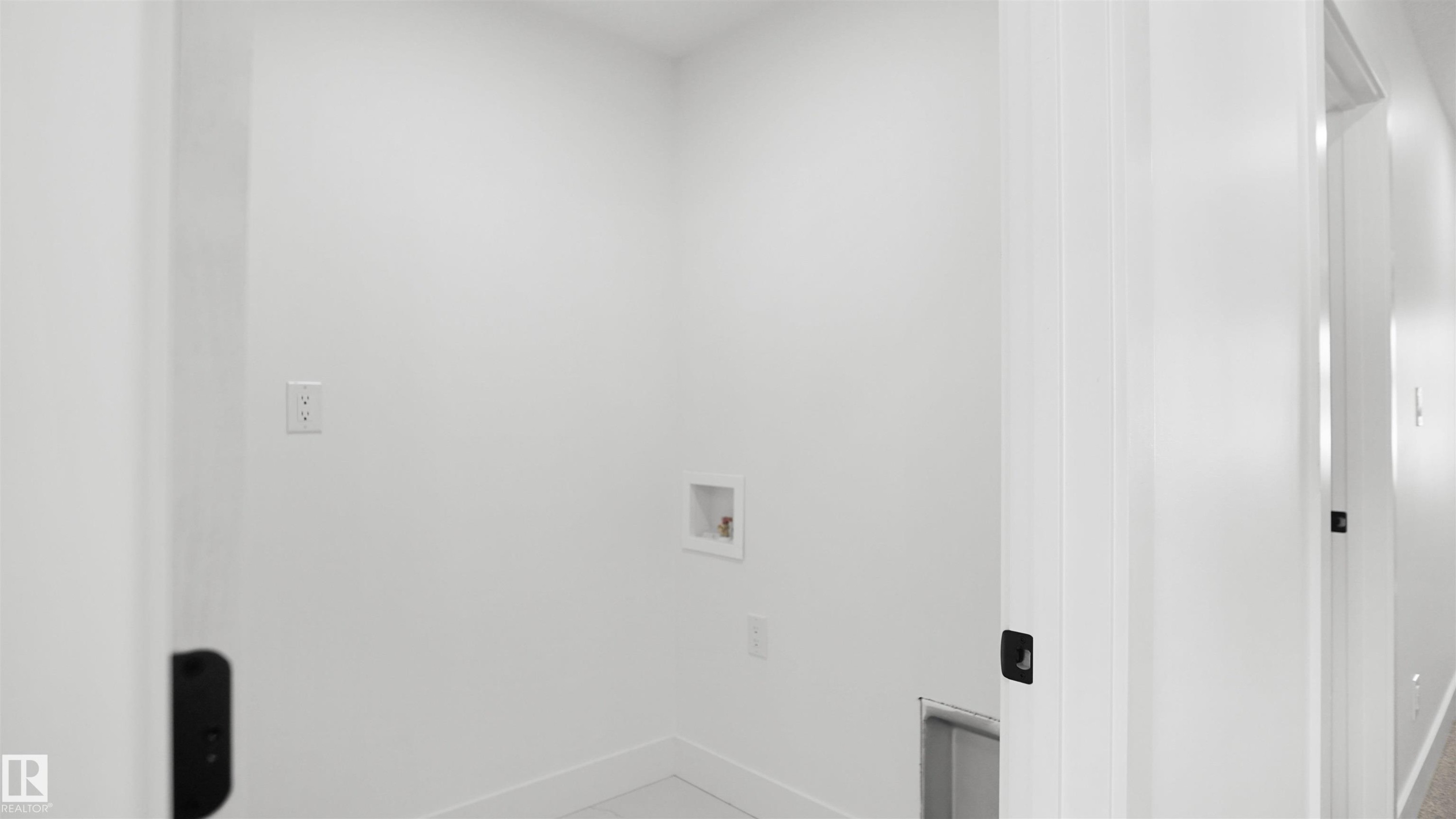 Laundry room featuring washer hookup and baseboards - 807 30 Avenue, Edmonton, AB - Indoor Photo Showing Other Room