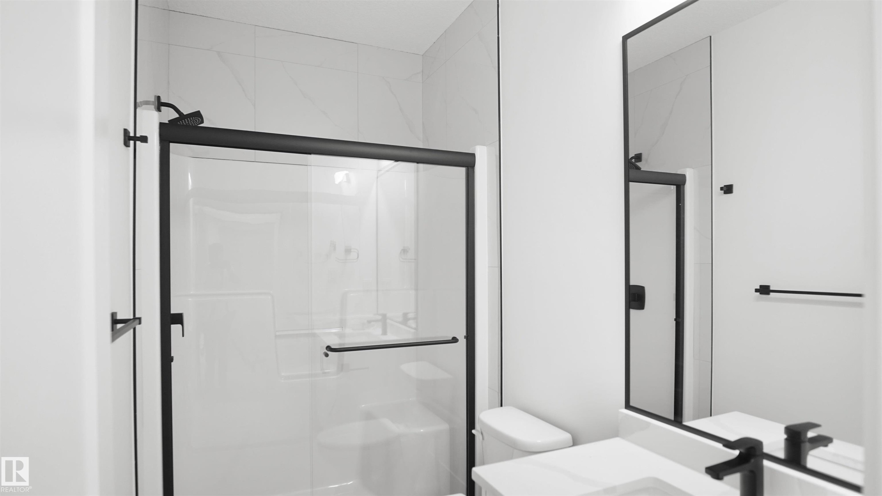 Bathroom with vanity and a stall shower - 807 30 Avenue, Edmonton, AB - Indoor Photo Showing Bathroom