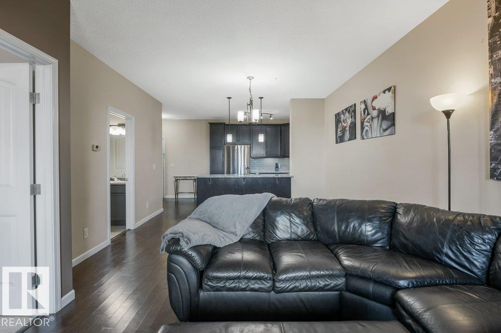 217 6083 Maynard Way, Edmonton, AB - Indoor Photo Showing Living Room