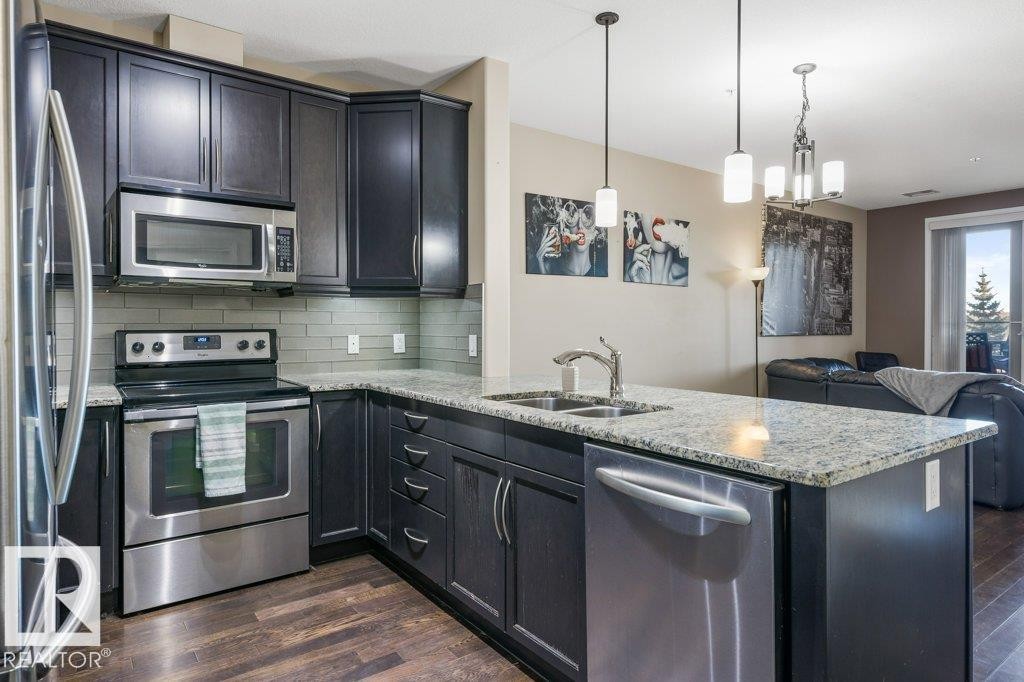 217 6083 Maynard Way, Edmonton, AB - Indoor Photo Showing Kitchen With Stainless Steel Kitchen With Double Sink With Upgraded Kitchen