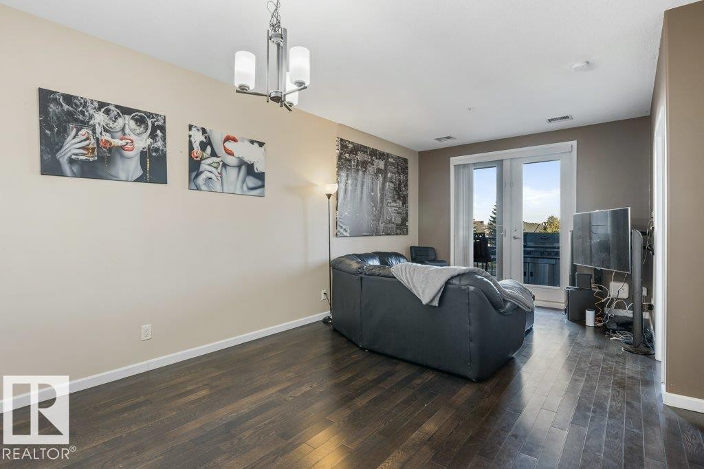 217 6083 Maynard Way, Edmonton, AB - Indoor Photo Showing Living Room