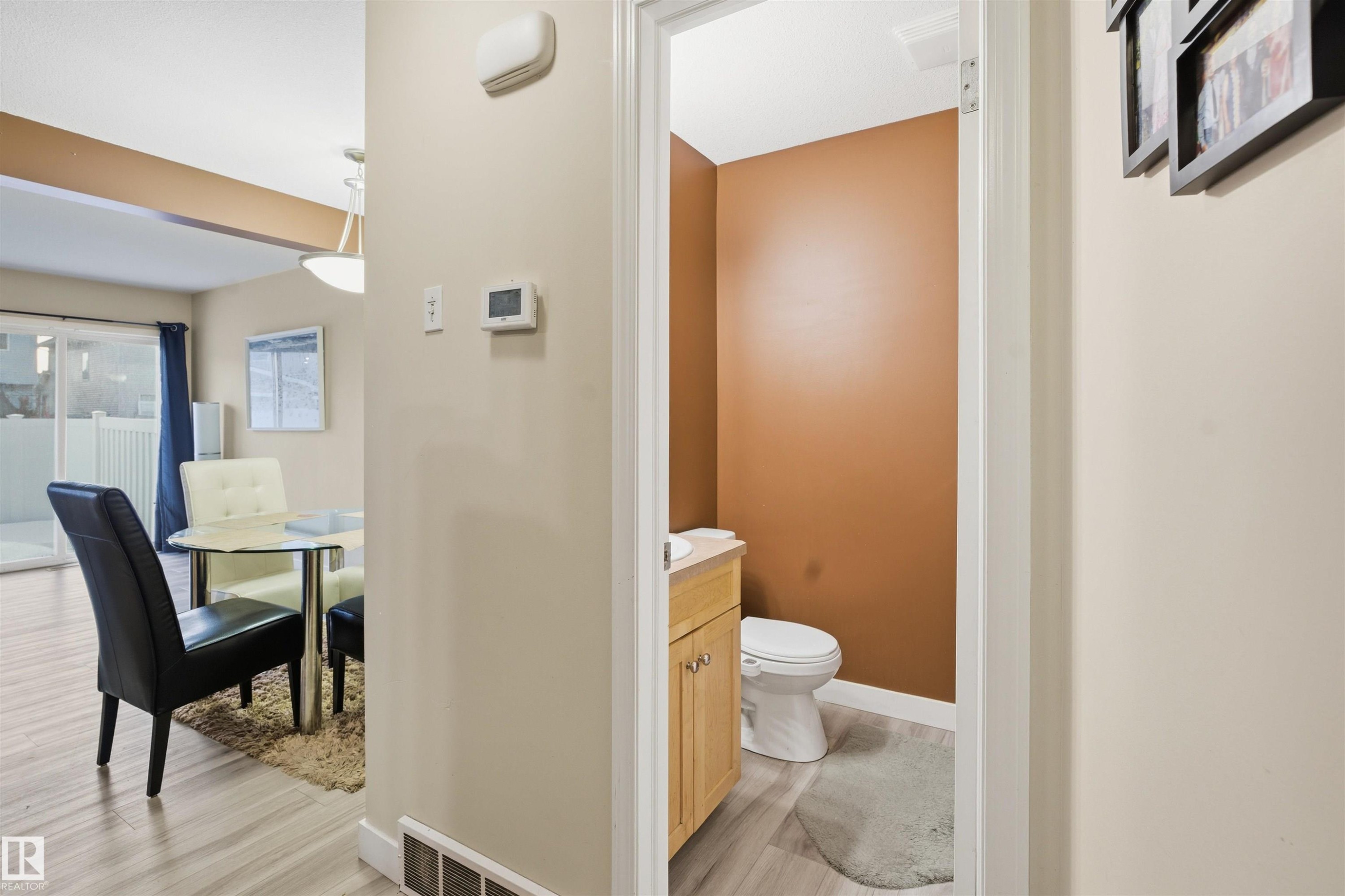 Bathroom featuring vanity and light wood-style floors - 8 230 Edwards Drive, Edmonton, AB - Indoor Photo Showing Bathroom