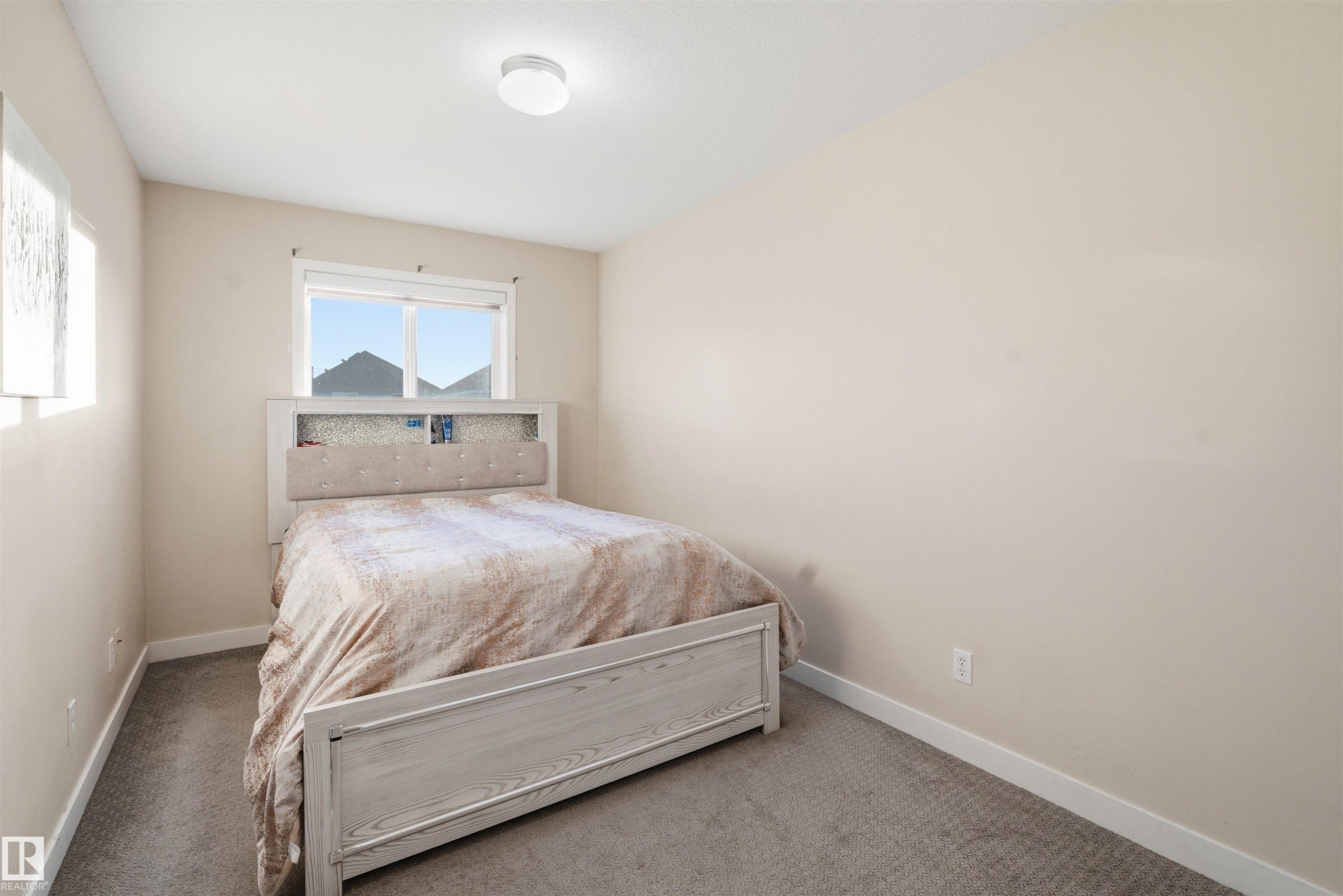 Bedroom with carpet - 8 230 Edwards Drive, Edmonton, AB - Indoor Photo Showing Bedroom