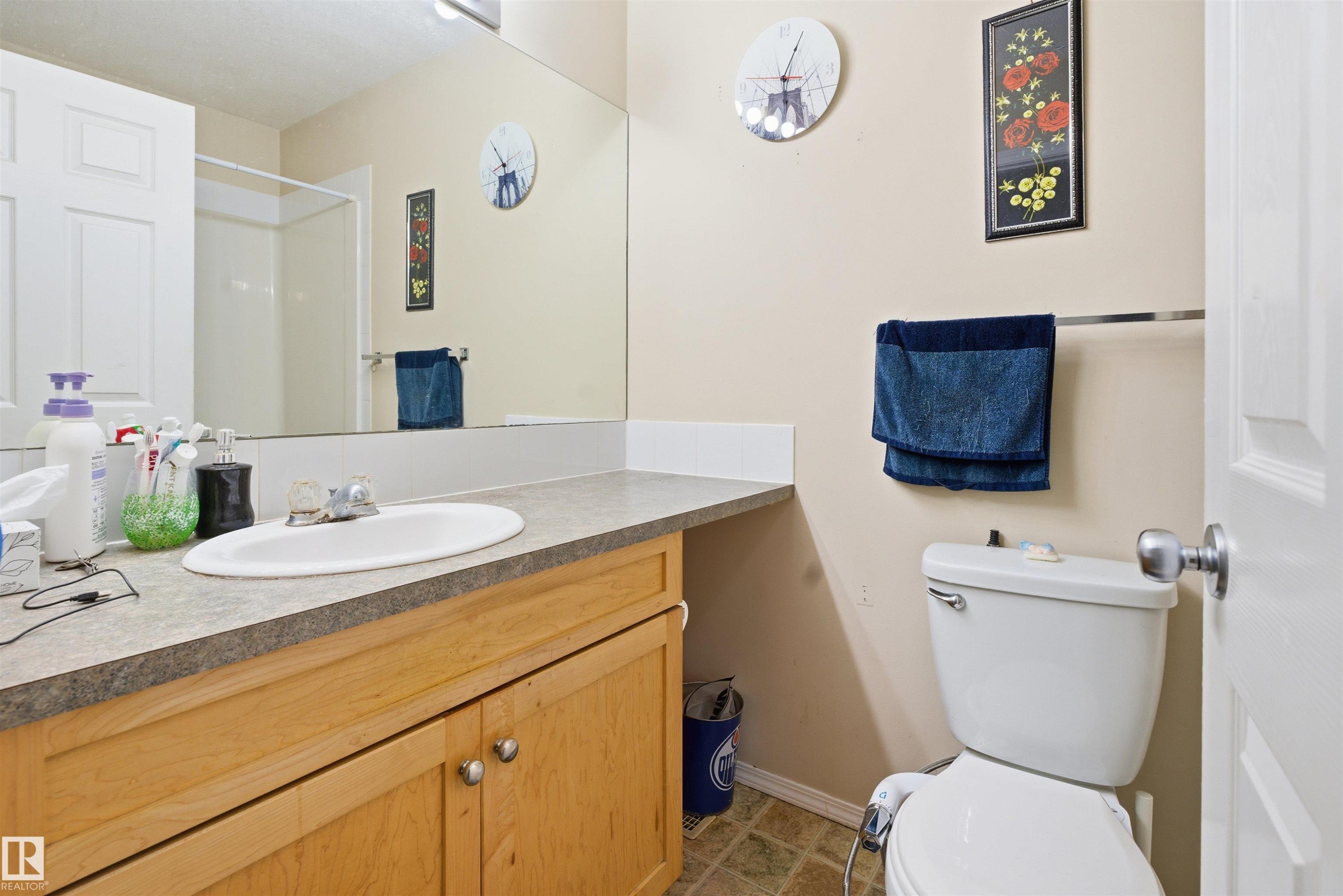 Full bathroom with vanity and a shower - 8 230 Edwards Drive, Edmonton, AB - Indoor Photo Showing Bathroom
