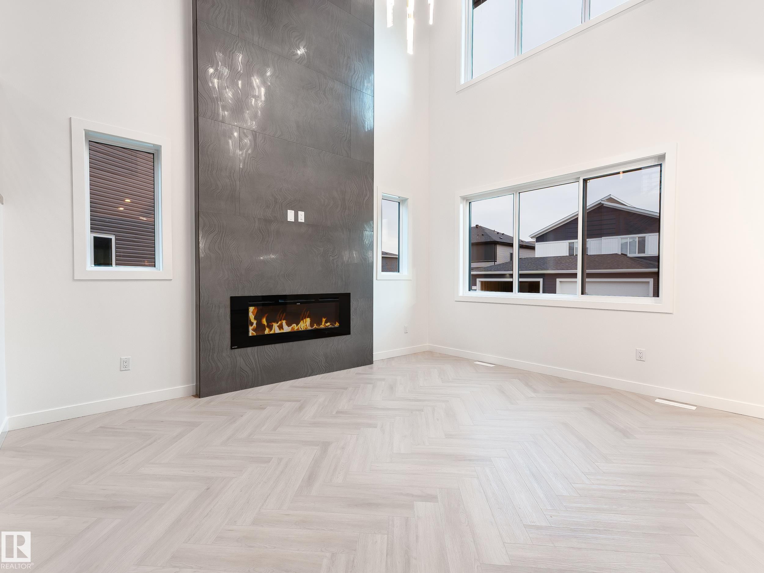 125 Lilac Close, Leduc, AB - Indoor Photo Showing Other Room With Fireplace