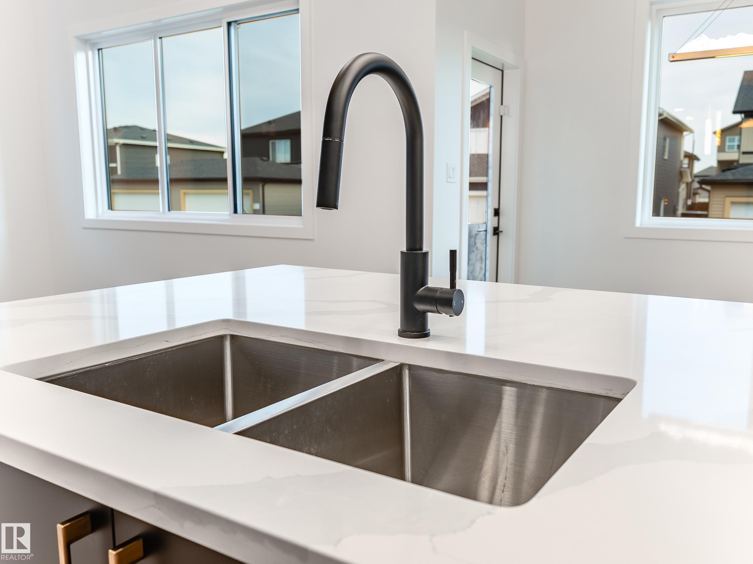 125 Lilac Close, Leduc, AB - Indoor Photo Showing Kitchen With Double Sink
