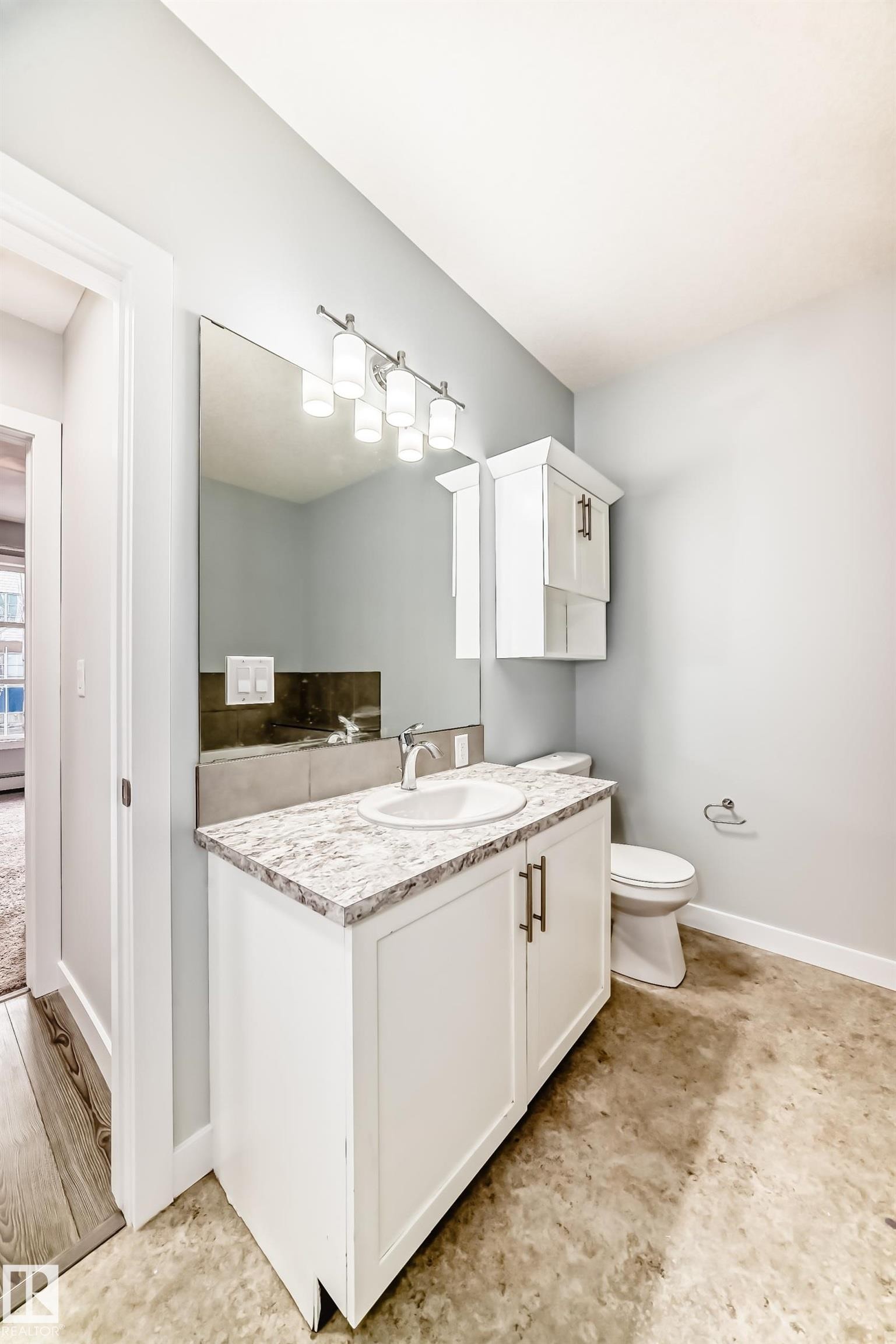 Bathroom featuring vanity and baseboards - 201 2588 Anderson Way, Edmonton, AB - Indoor Photo Showing Other Room