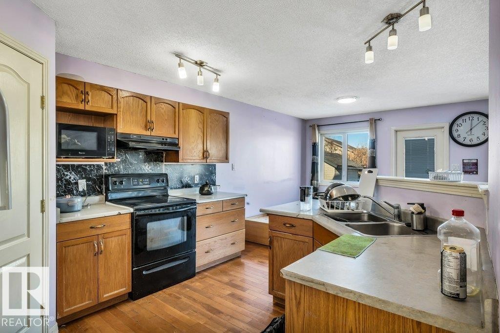 2144 37B Avenue, Edmonton, AB - Indoor Photo Showing Kitchen With Double Sink