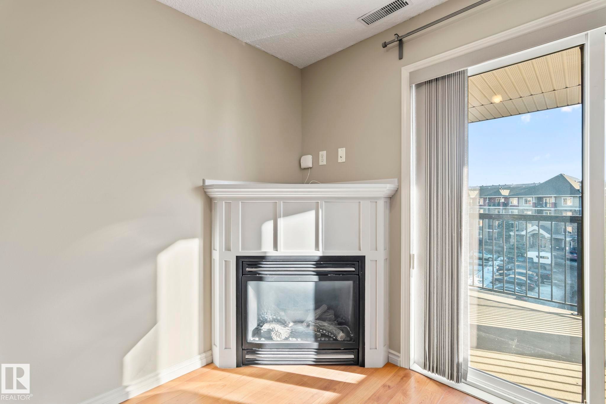 408 2098 Blackmud Creek Drive, Edmonton, AB - Indoor With Fireplace