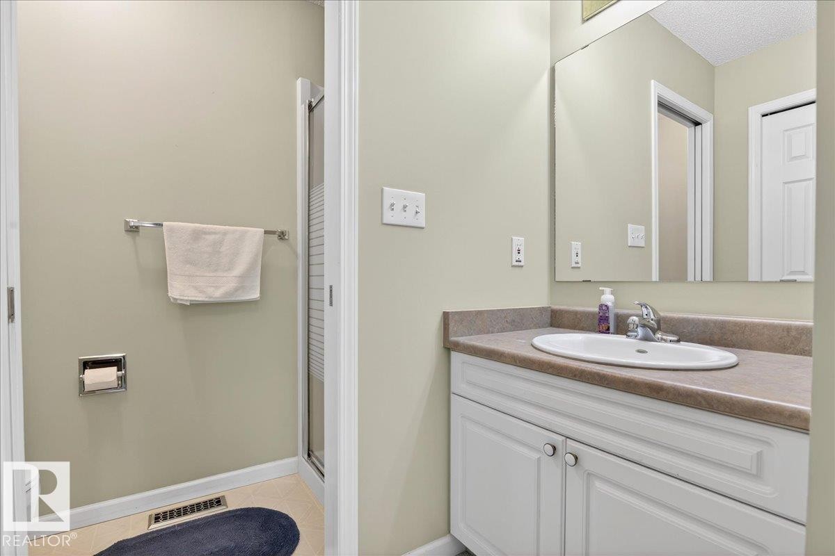 Bathroom featuring vanity and a shower stall - 13217 155 Avenue Nw, Edmonton, AB - Indoor Photo Showing Bathroom