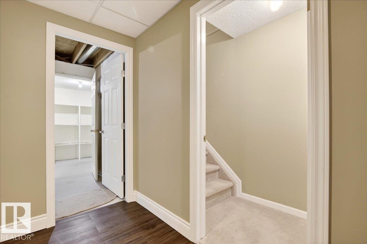 Corridor featuring baseboards and carpet floors - 13217 155 Avenue Nw, Edmonton, AB - Indoor Photo Showing Other Room