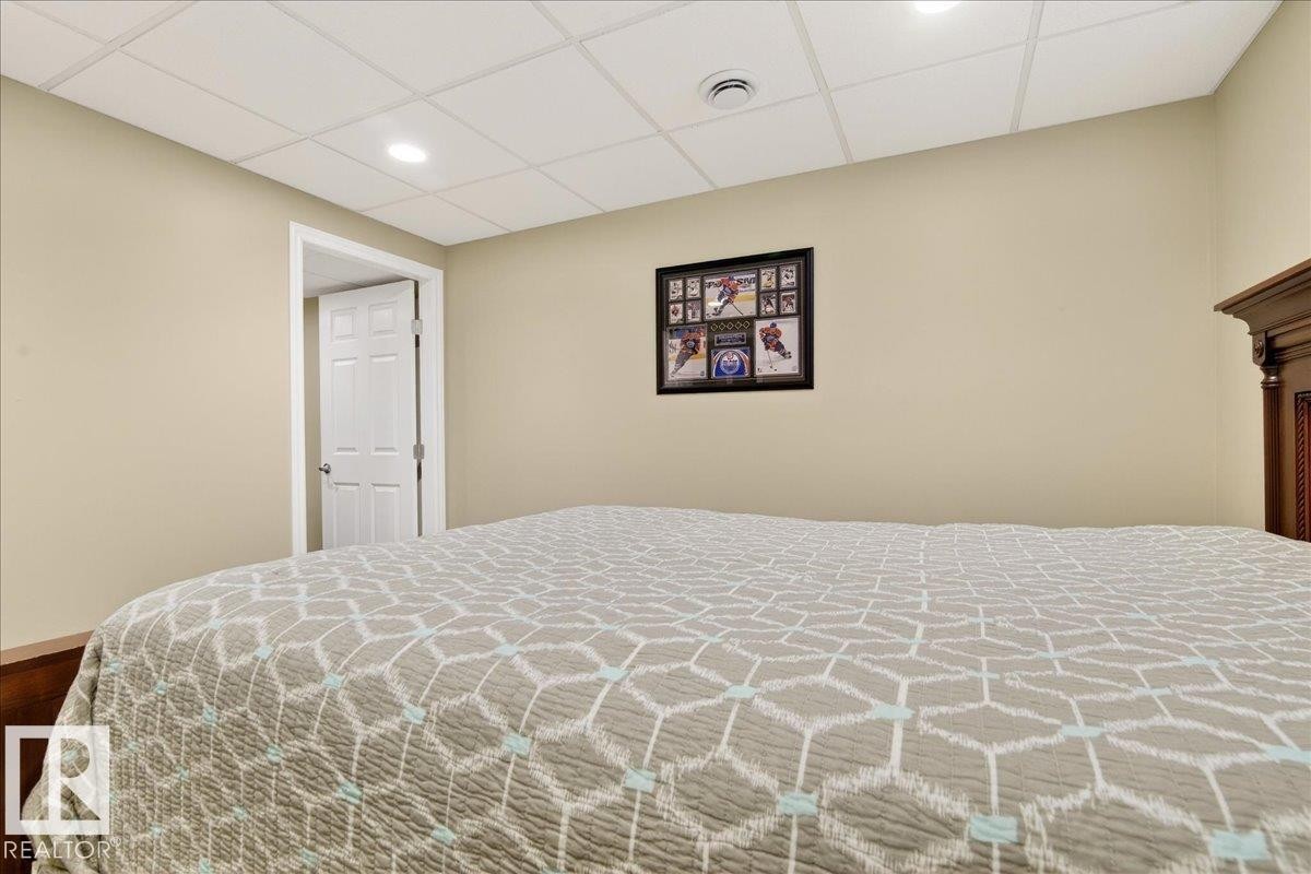 Bedroom featuring a paneled ceiling and recessed lighting - 13217 155 Avenue Nw, Edmonton, AB - Indoor Photo Showing Bedroom