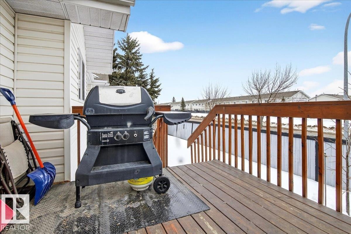 Deck with a grill and a residential view - 13217 155 Avenue Nw, Edmonton, AB - Outdoor With Exterior