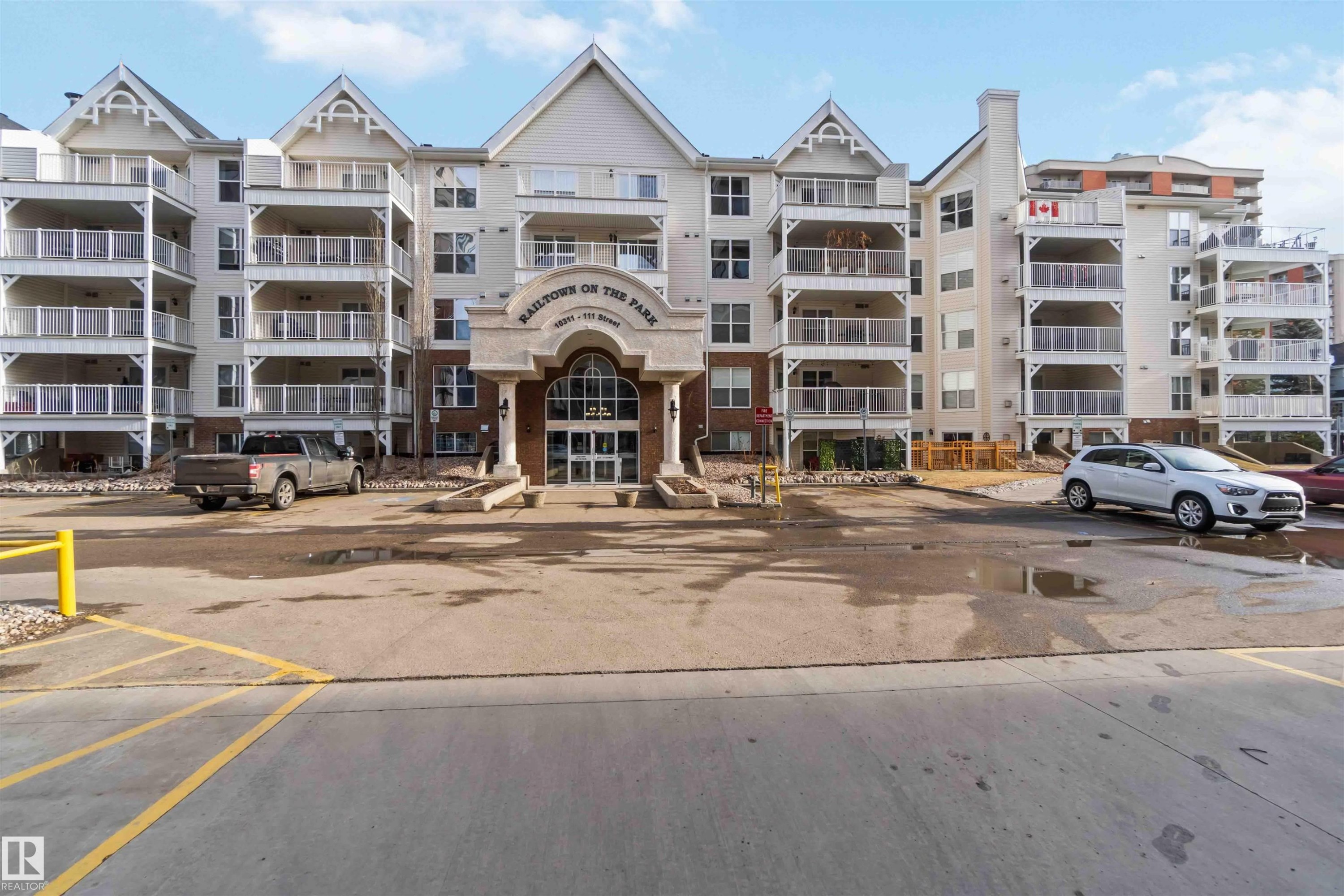 View of apartment building / complex with uncovered parking - 113 10311 111 Street, Edmonton, AB - Outdoor With Facade