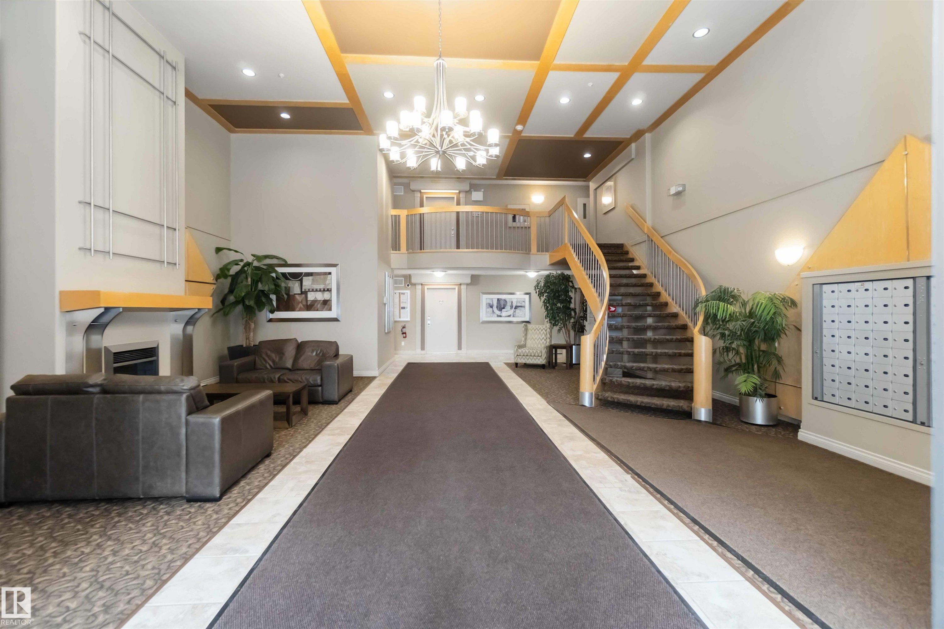 Common area with recessed lighting and high coffered ceiling - 113 10311 111 Street, Edmonton, AB - Indoor Photo Showing Other Room
