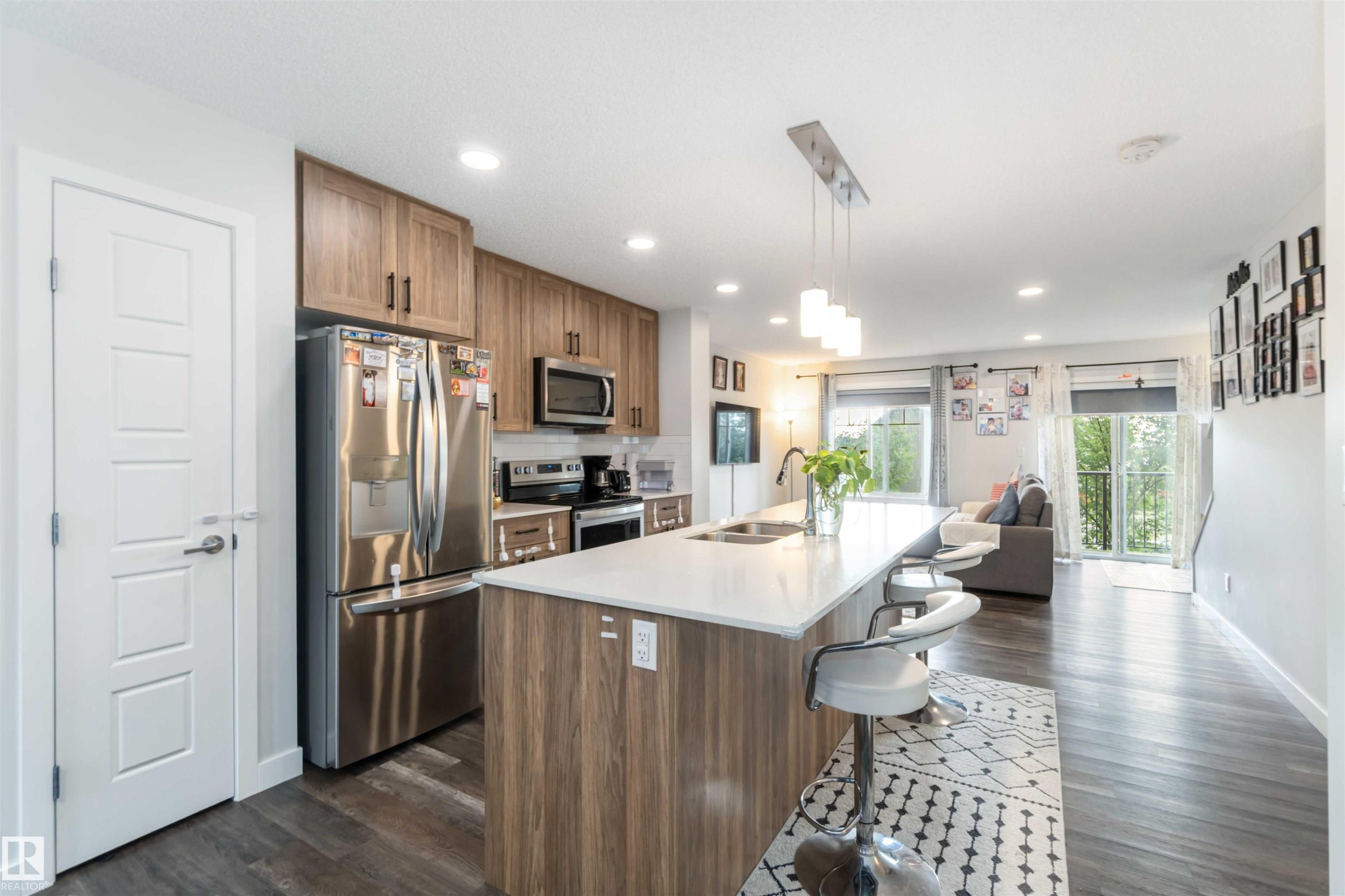 3 3305 Orchards Link Sw, Edmonton, AB - Indoor Photo Showing Kitchen With Stainless Steel Kitchen With Double Sink
