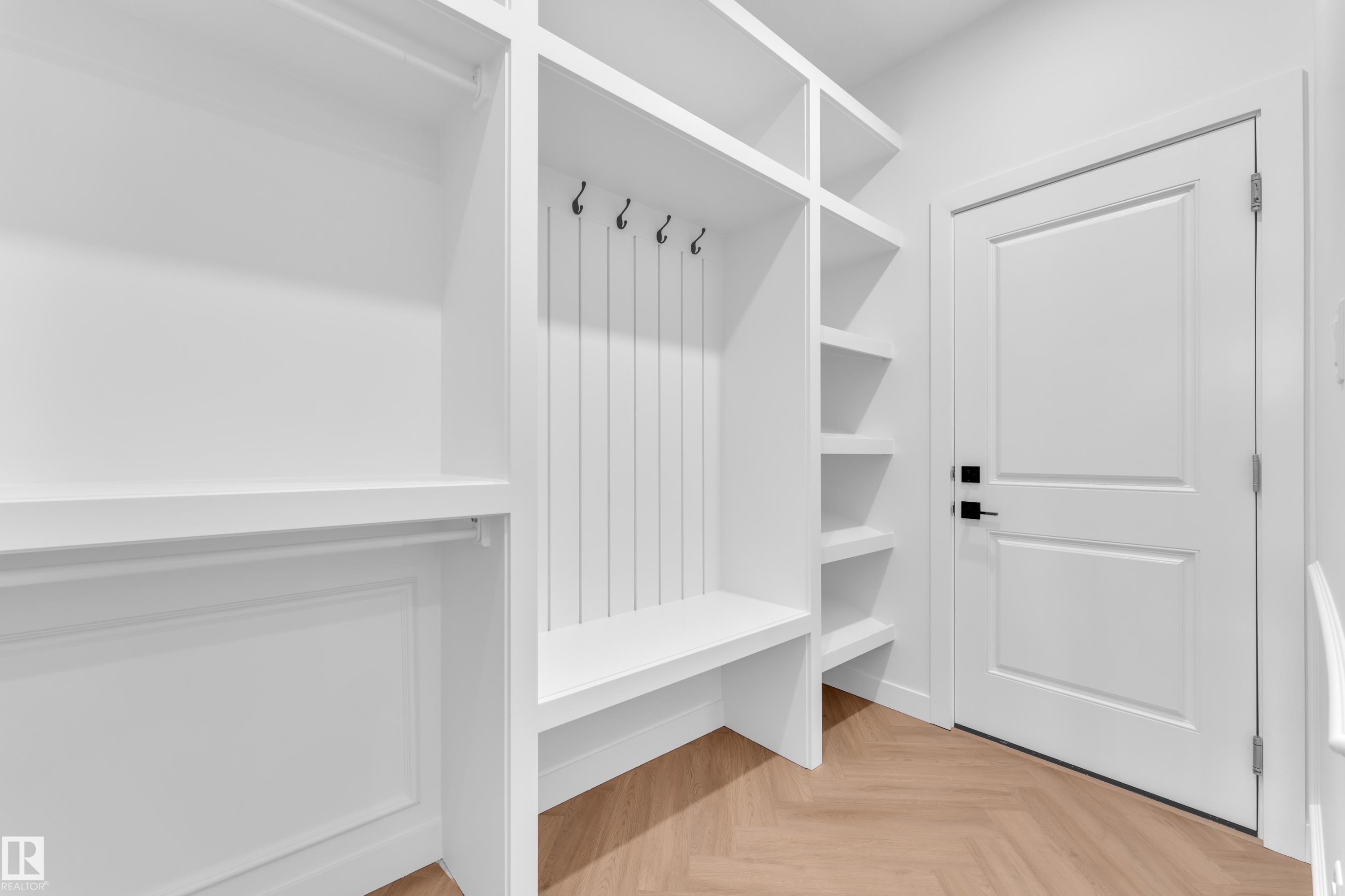 Mudroom featuring parquet floors - 38 Grayson Green, Stony Plain, AB - Indoor With Storage