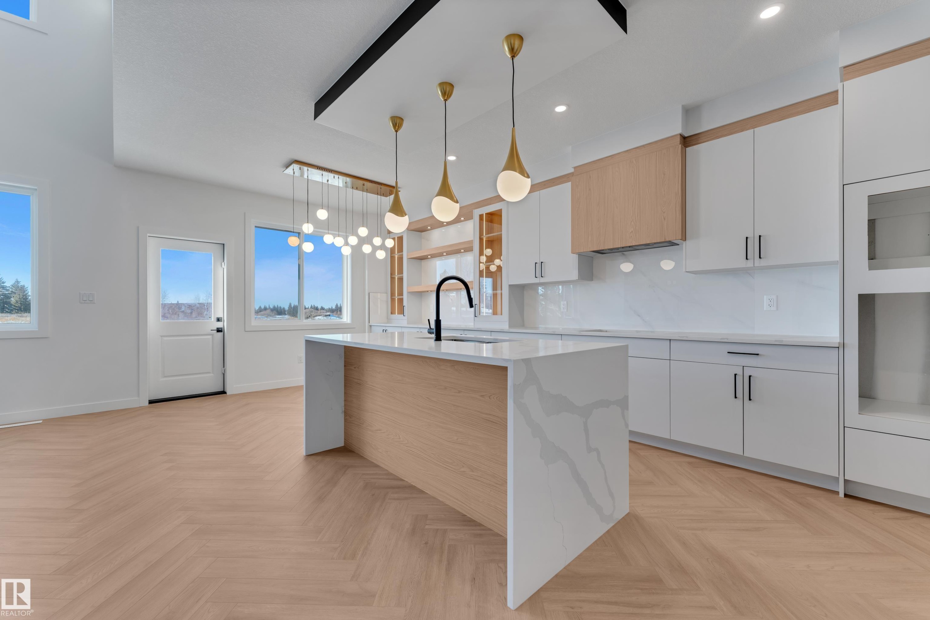 Kitchen featuring white cabinetry, decorative light fixtures, backsplash, and parquet floors - 38 Grayson Green, Stony Plain, AB - Indoor Photo Showing Kitchen With Upgraded Kitchen